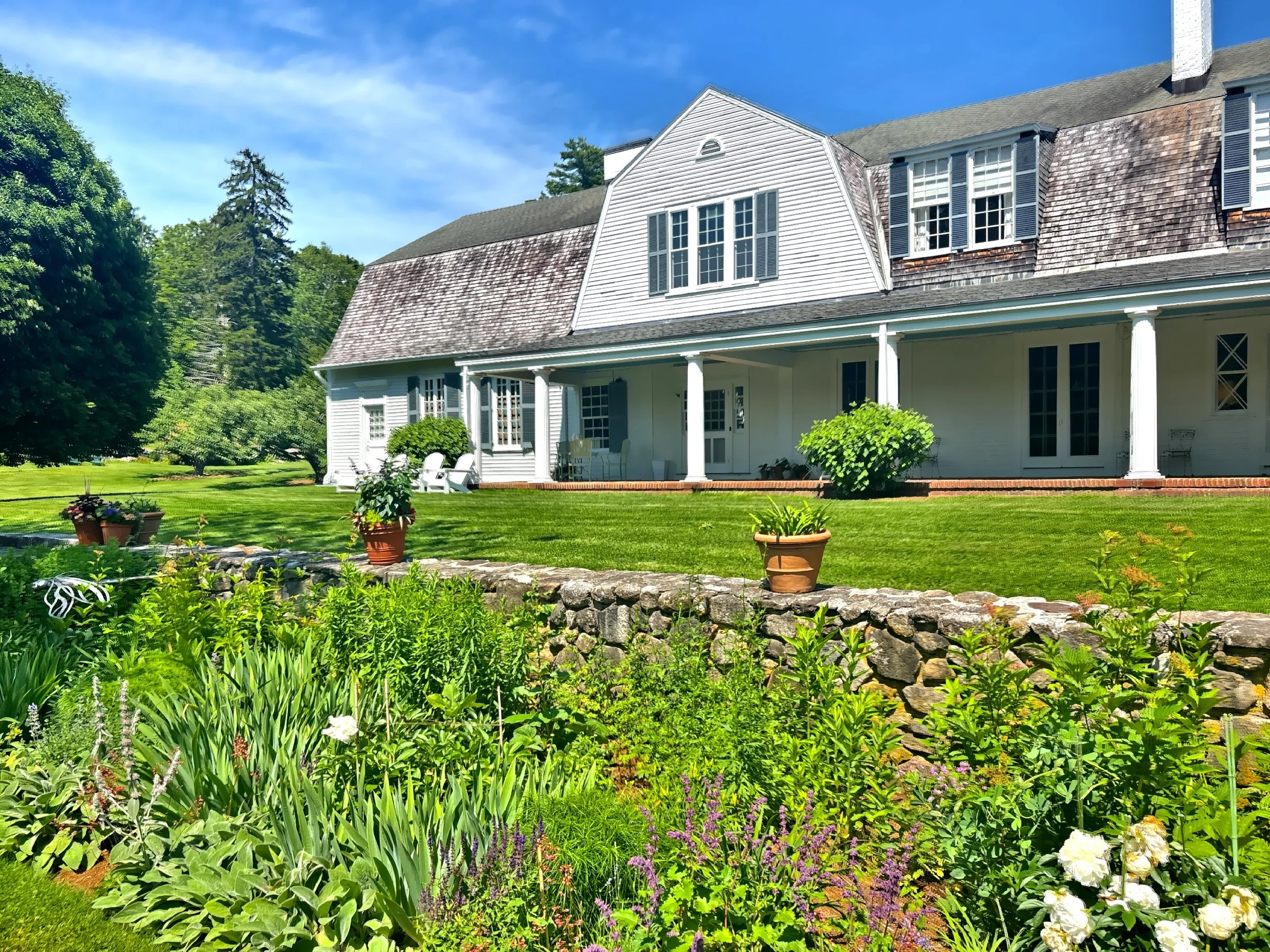  The perennial plant border and stone wall on the west side of the house. 