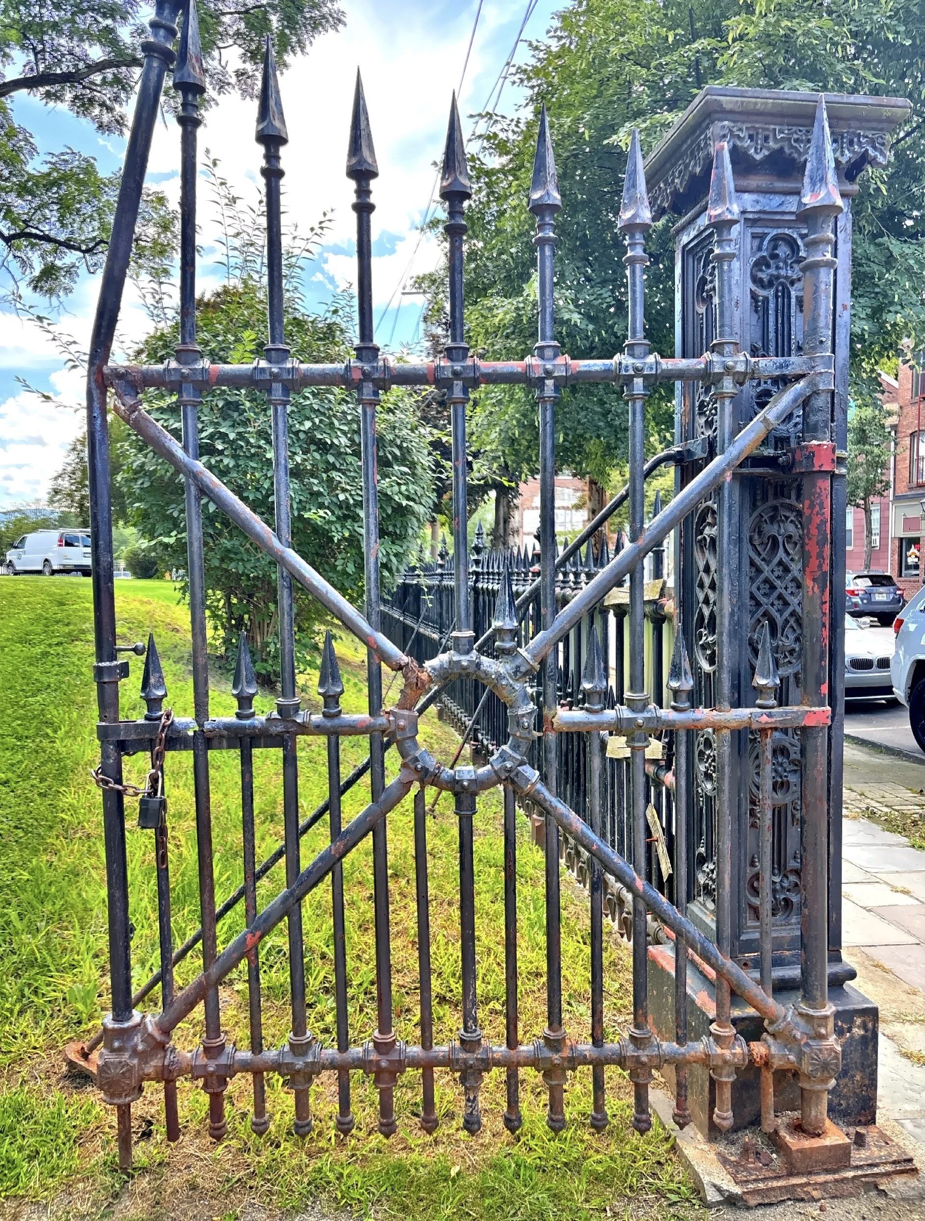  The tall wrought iron gate that surrounds the property. 