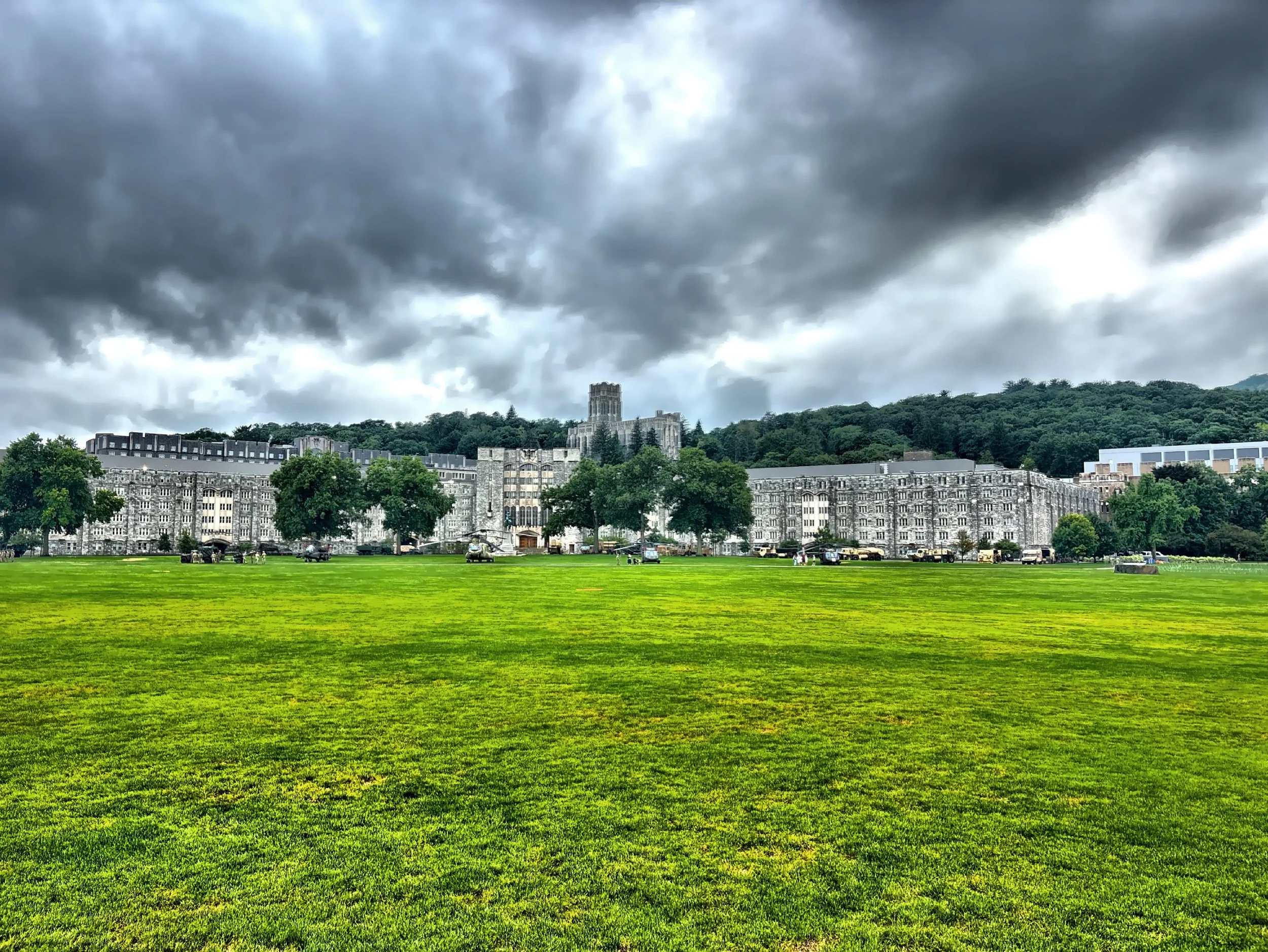  The wide green expanse of The Plain, the cadet parade field, with historic academic, barracks buildings and Cadet Chapel high on the hill in the background. 
