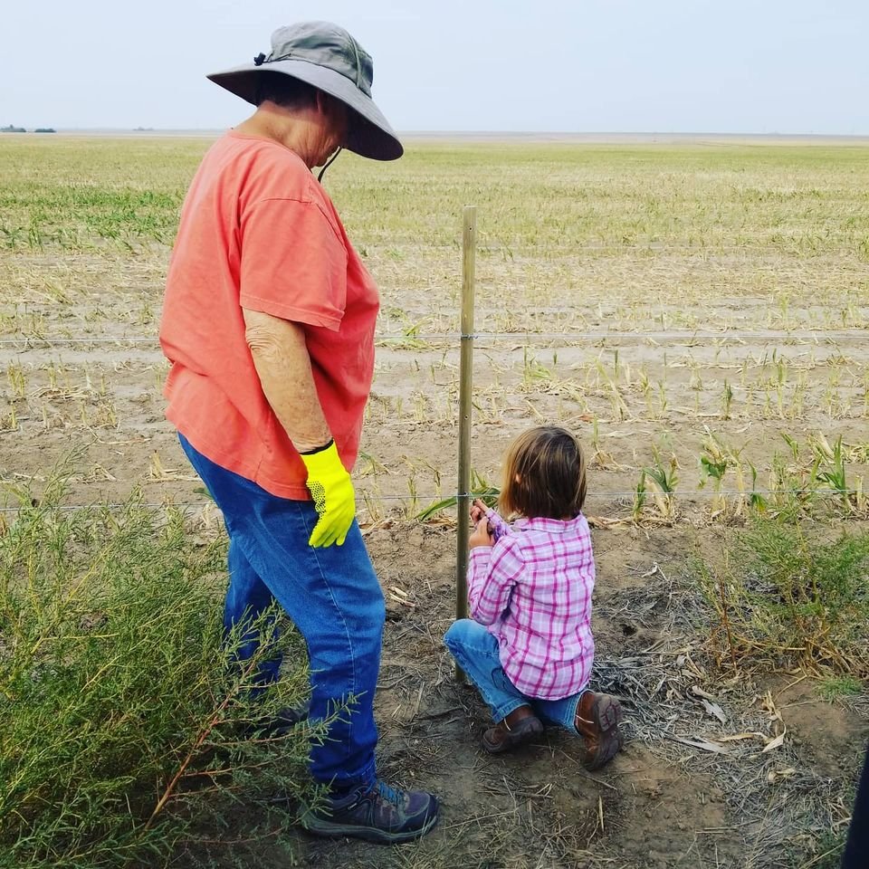 Ellie and grandma fixin fence.jpg