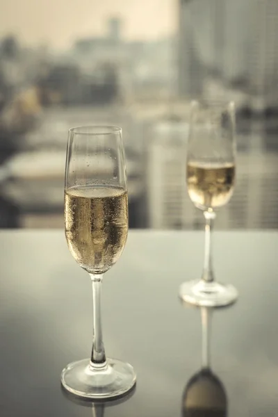 glasses-champagne-rooftop-restaurant-city-600nw-1231132192.webp