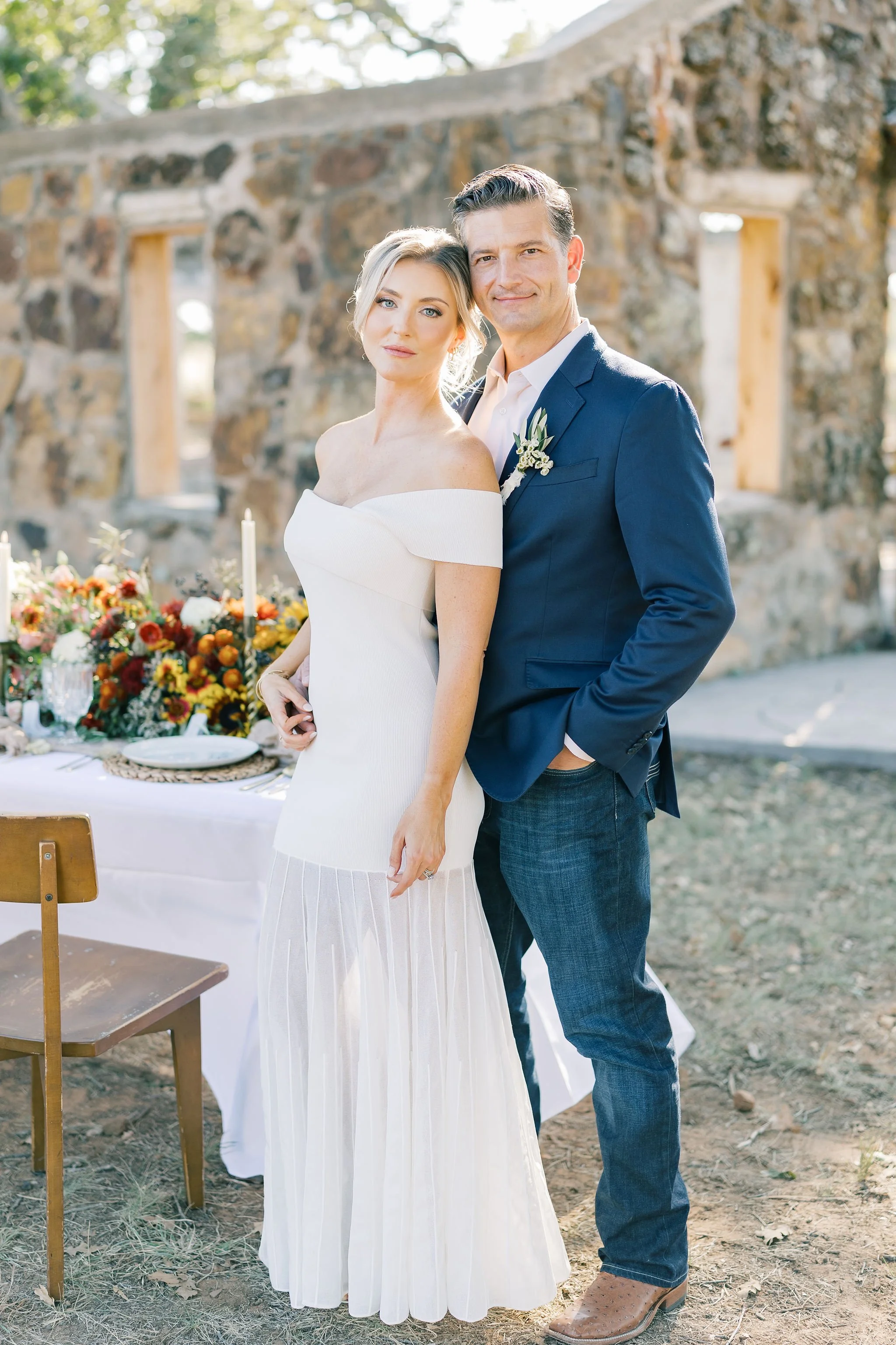 Luxury wedding photography with bride and groom in outdoor rustic wedding venue