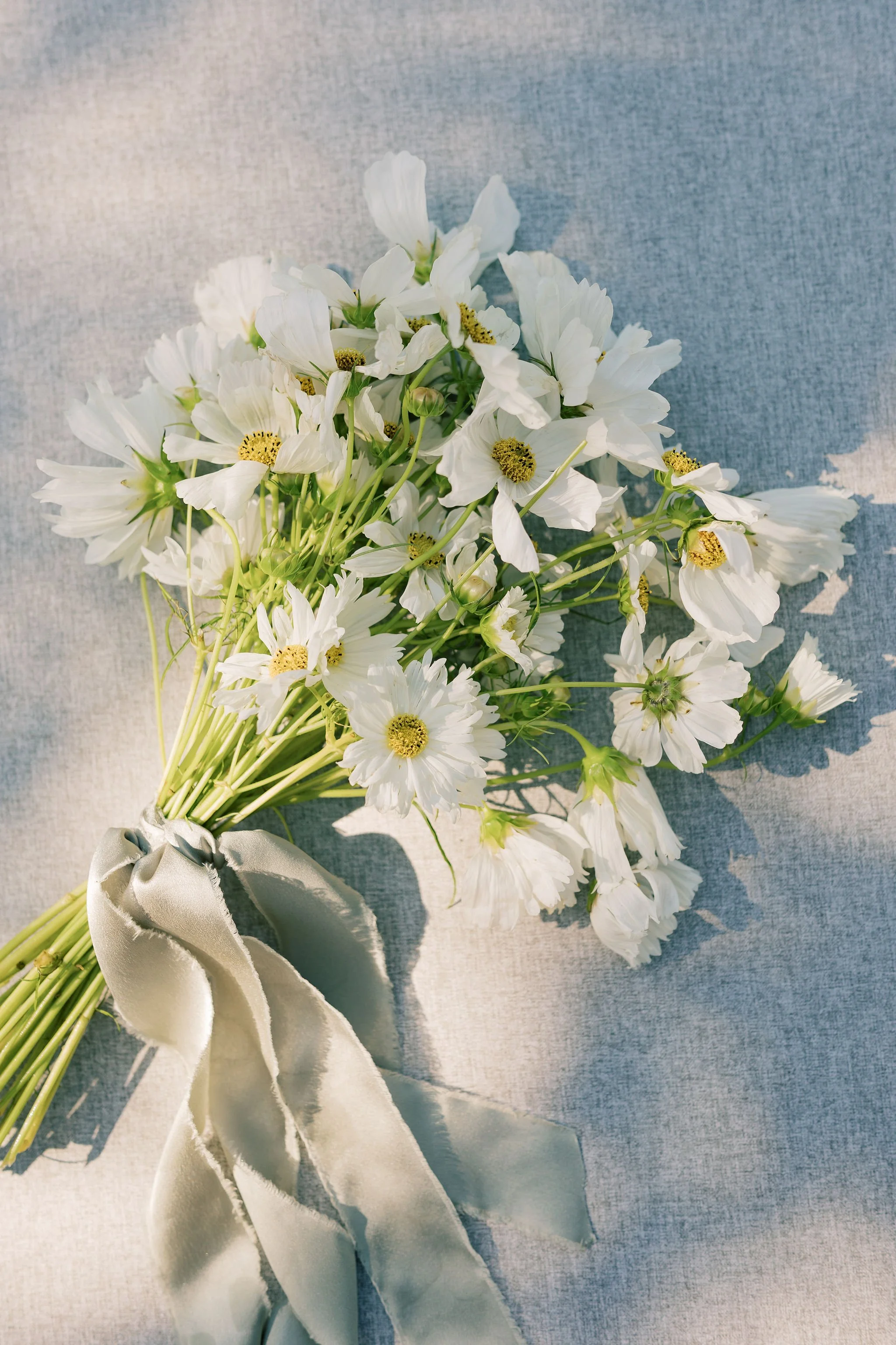 Simple elegant white bridal bouquet with ribbon
