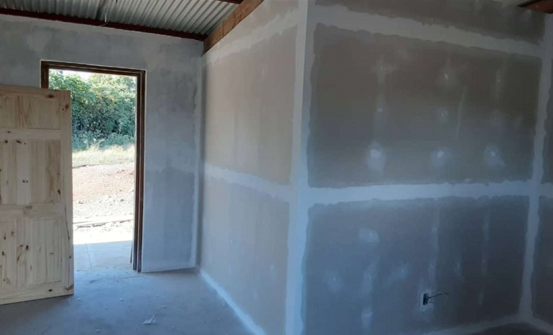 Interior walls were drywalled and doors were installed.