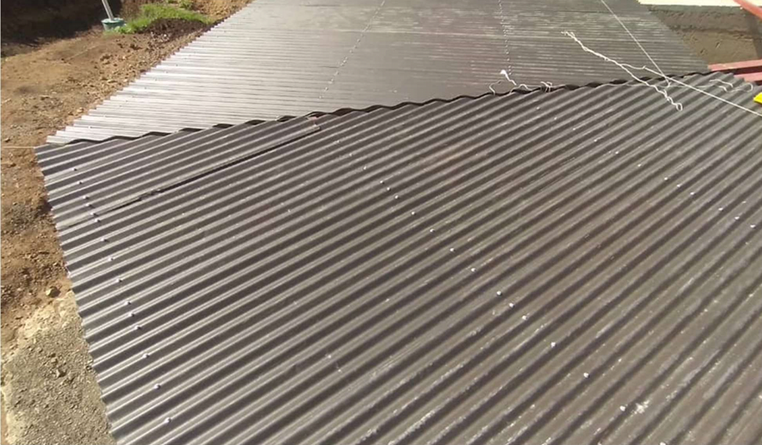 Roofing material was fastened to the purlins.