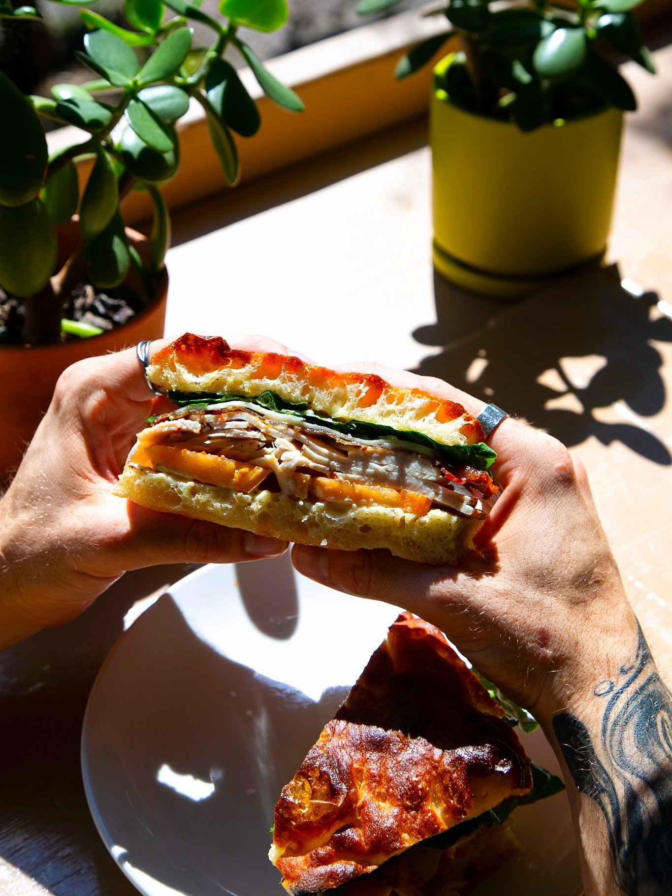 turkey club 🥪

stacked with turkey, candied bacon, heirloom tomato, romaine, provolone, and garlic aioli on housemade focaccia

✨available during lunch from 11:00 am&ndash;2:30 pm✨