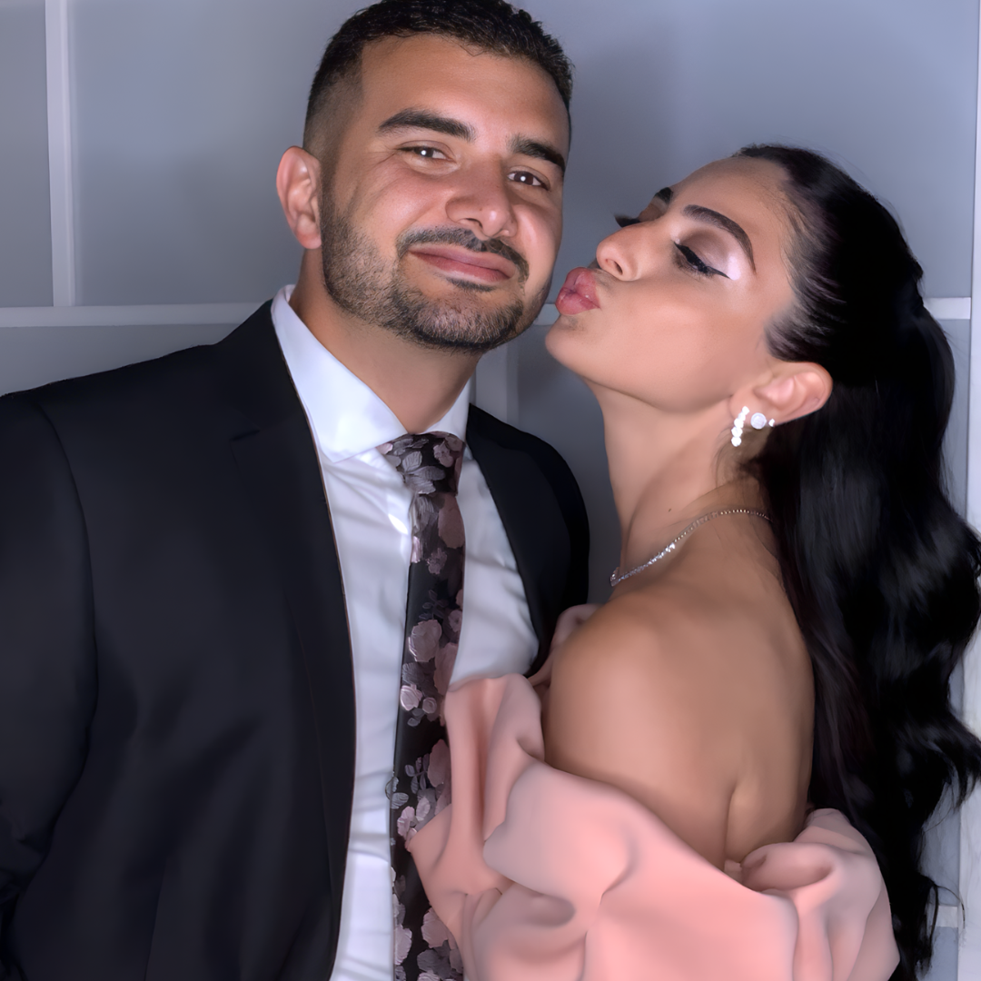 Couple posing in front of a glam photo booth at a wedding in Ottawa