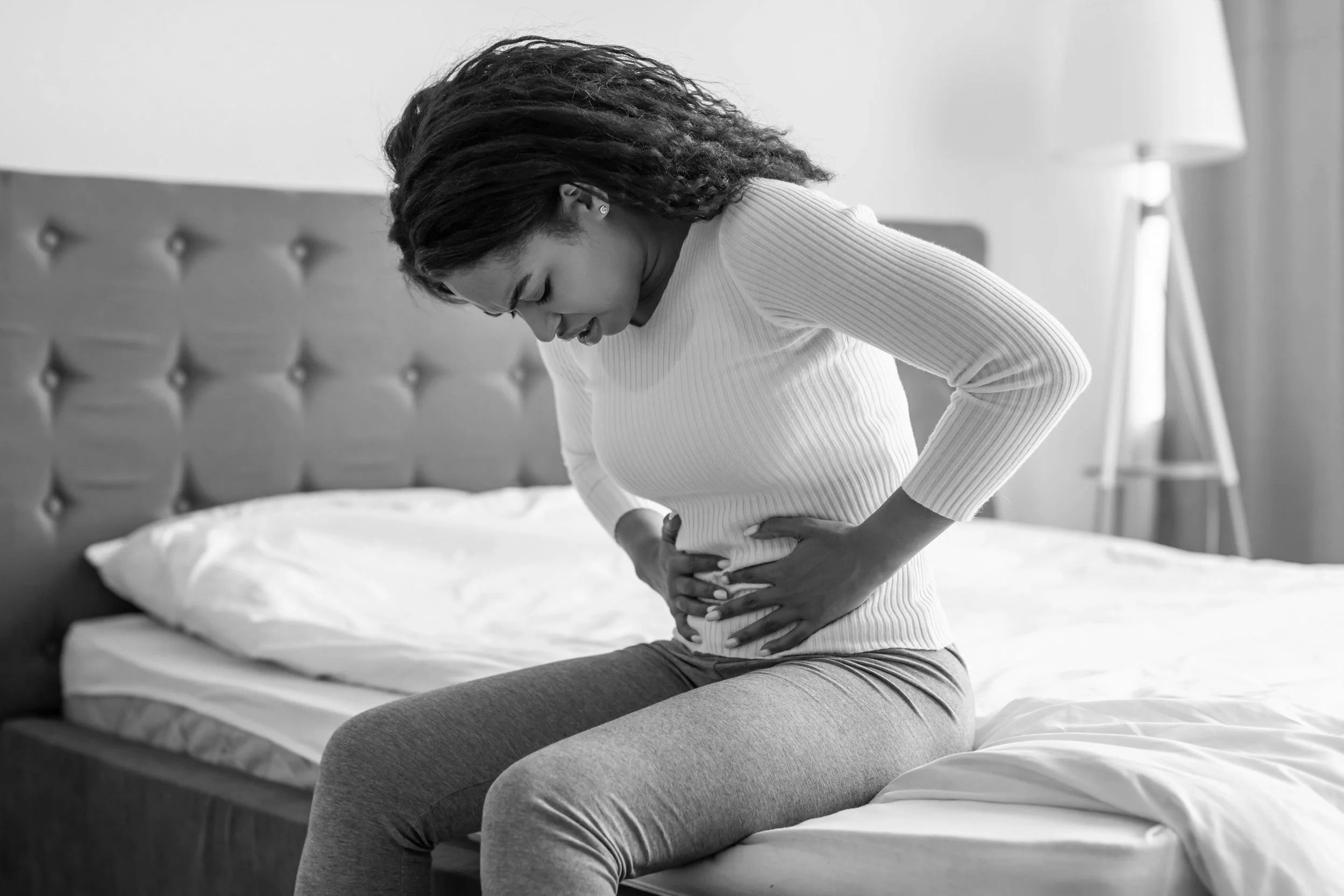 black-woman-suffering-from-stomachache-touching-h-2021-09-02-22-29-26-utc.jpg