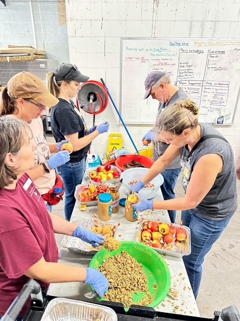 Volunteers working on building over 400 candy apples!