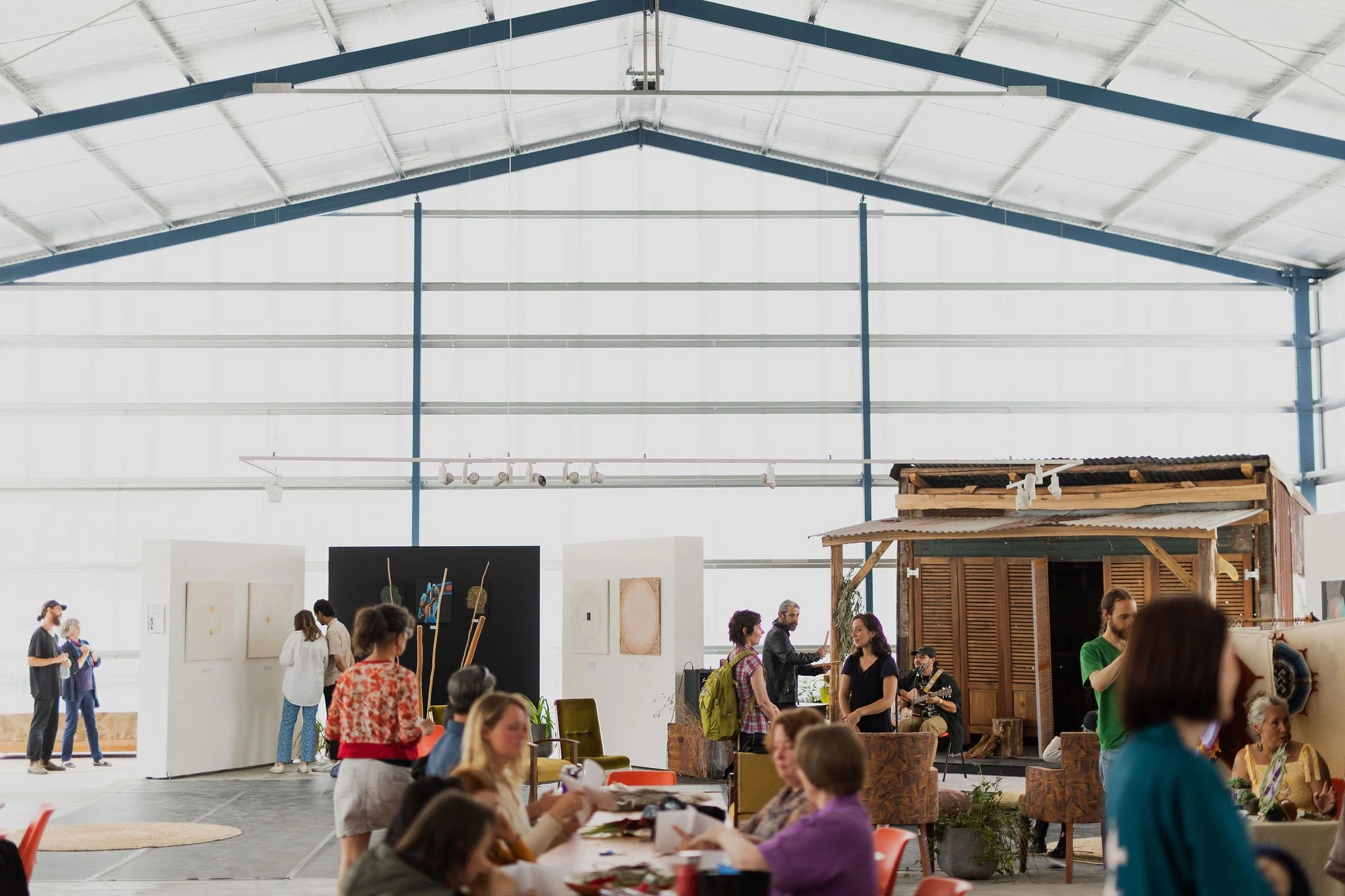 Image of people gathered at indoor market