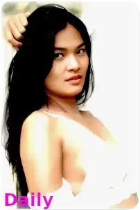Pattaya outcall escort Daily poses for the camera in white exuding confidence and charm in a erotic manner.