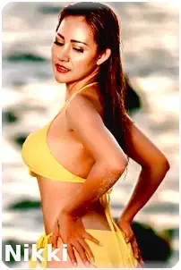 Pattaya Escort Nikki: Posing on the beach in yellow bikini