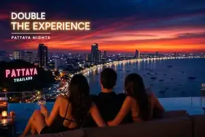 Three people sitting at a rooftop bar overlooking a city skyline at sunset or dusk, with a body of water and illuminated buildings.