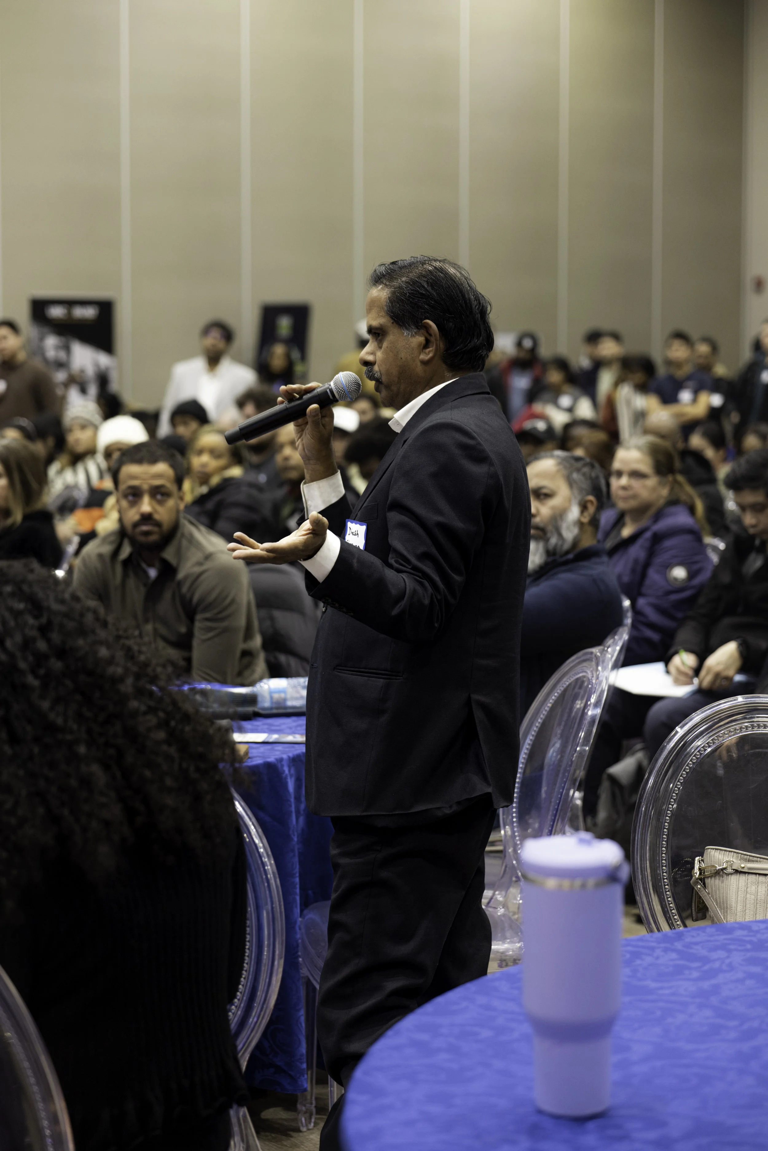 Speaker announcing at a Skills for Change Event