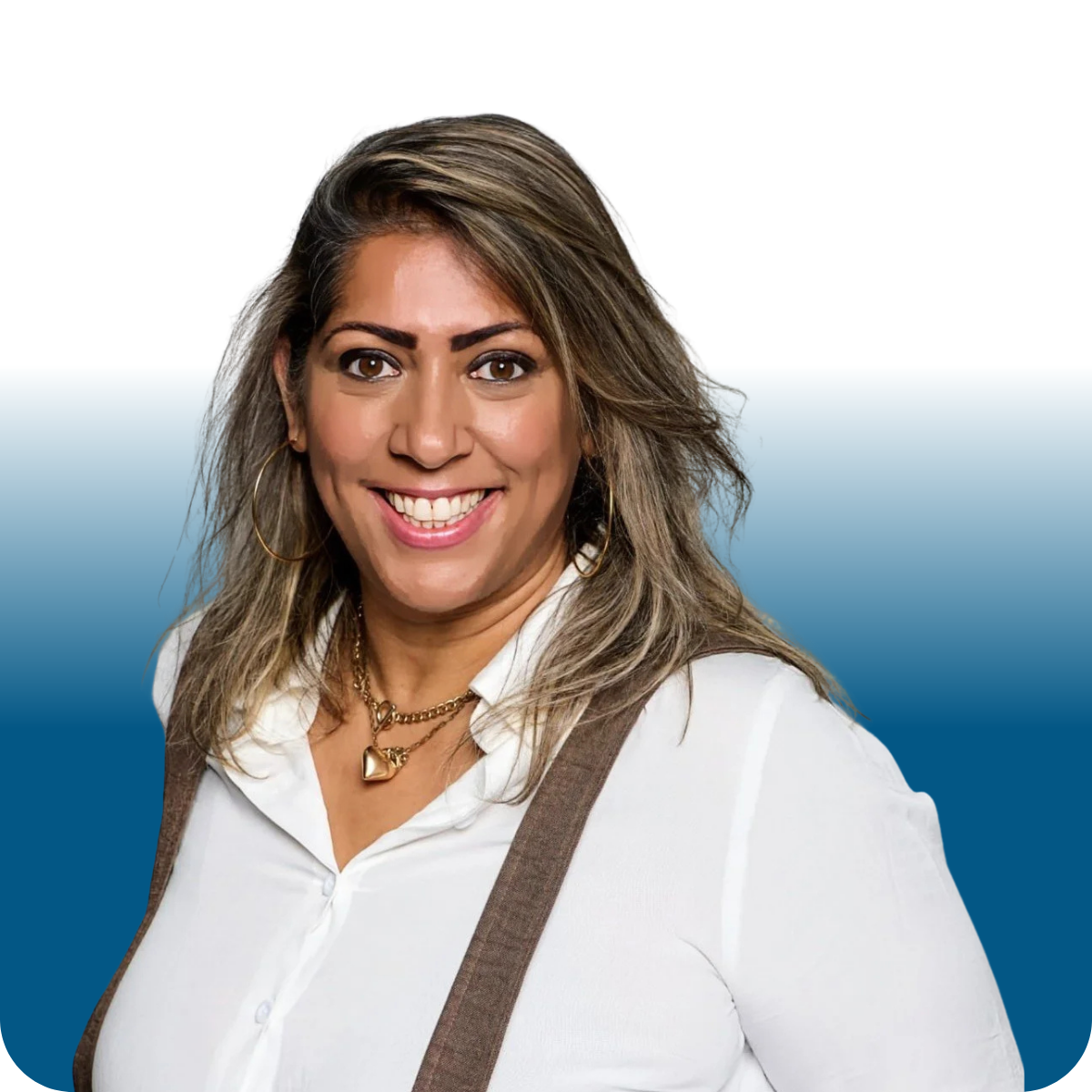 A woman with black hair and blonde highlights wearing a light blue and red beaded necklace