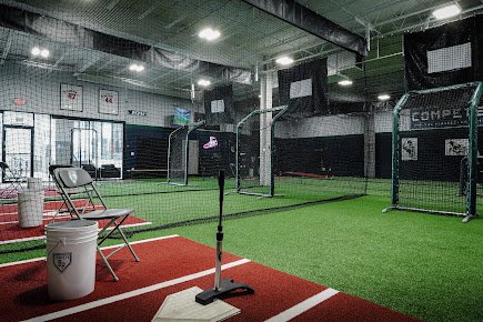 Indoor batting cages, turf, screens, and hitting area at Compete BP in Dallas