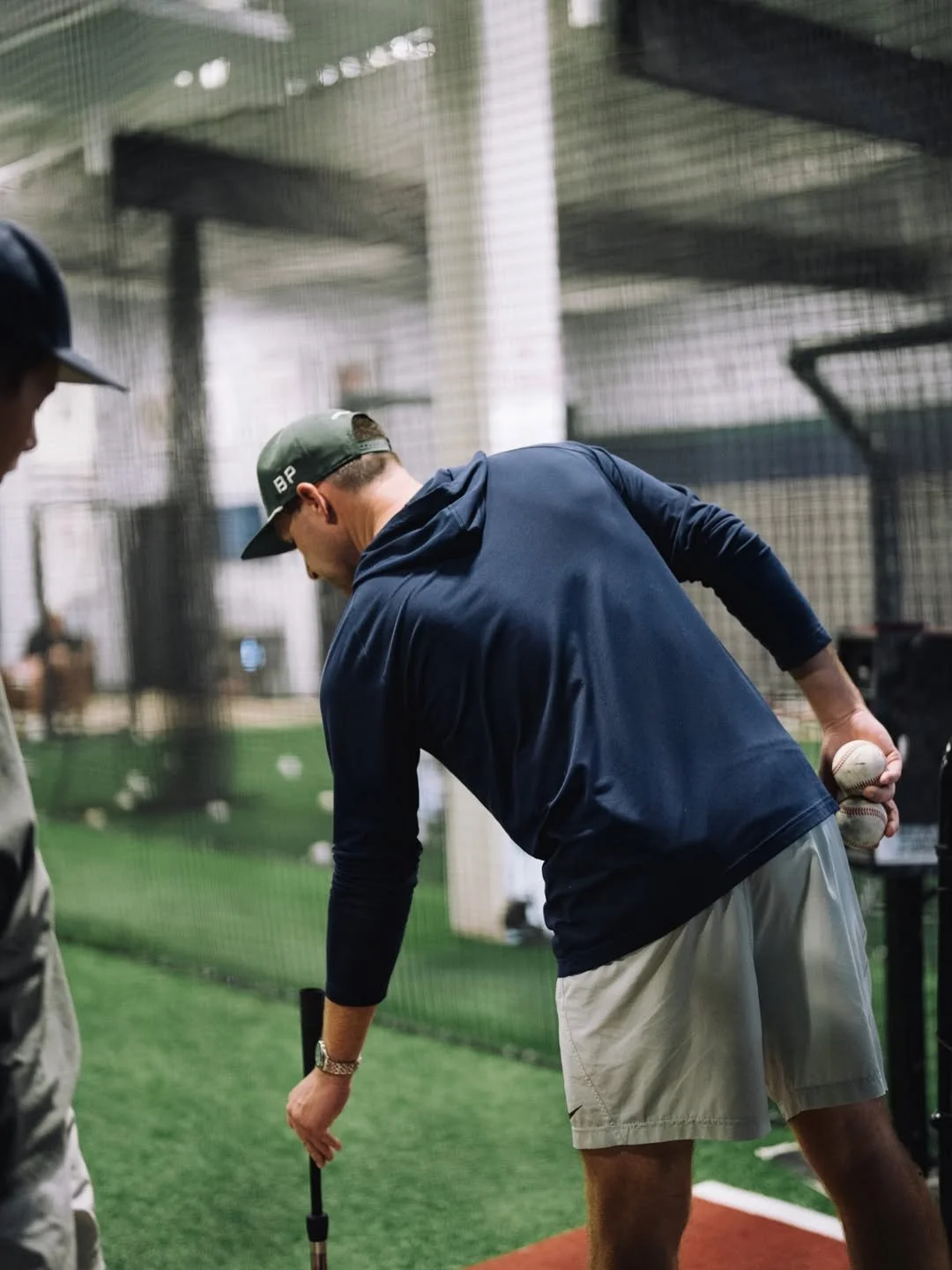 Franco Broyles coaching a player inside Compete BP