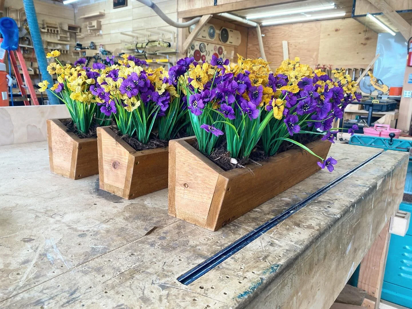 Flower boxes!  We&rsquo;ve made flower boxes to hang outside the windows of a treehouse before, but this time I wanted to fill them with something nice to start with for the clients.  I figured a little fake flower arrangement would be an easy low ma