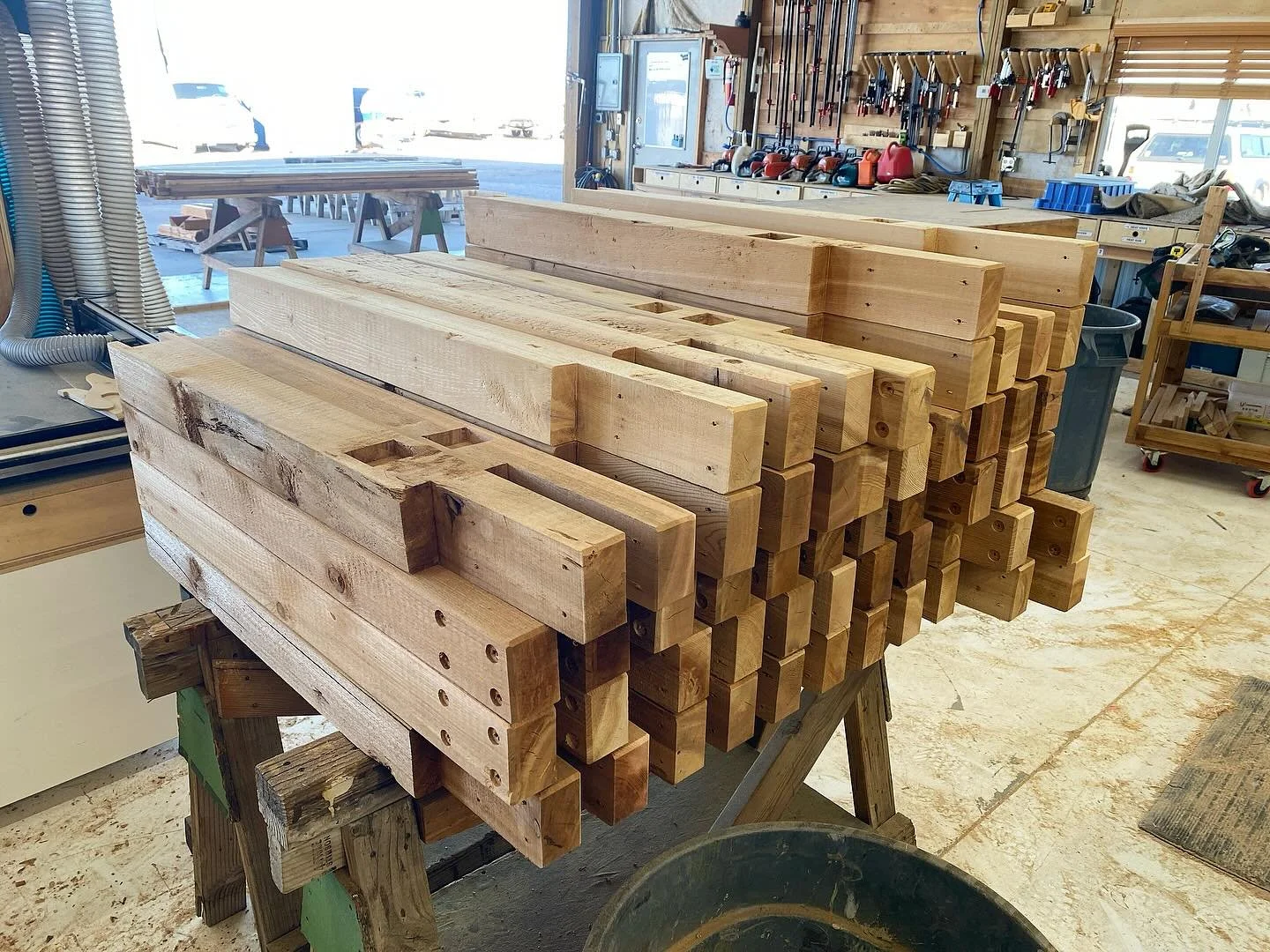 Prefab begins on Mendota!  Scenes from the shop over the last couple weeks.  Mitch is batching out handrail components.  Cullen cutting some of the brace timbers and beginning to frame walls.