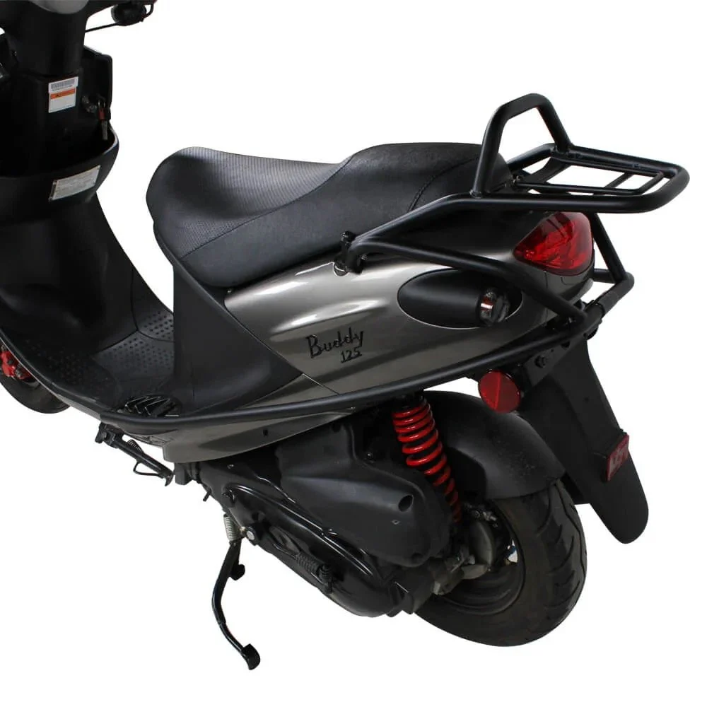 A black and gray scooter with a leather seat, a rear luggage rack, and a red coil spring suspension.