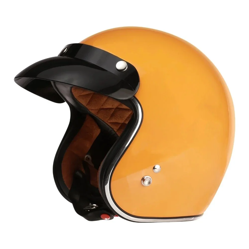 A vintage orange retro motorcycle helmet with black visor and brown interior padding.