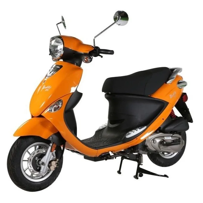 Orange scooter with black seat facing to the right, with shiny mirrors and a clear headlight.