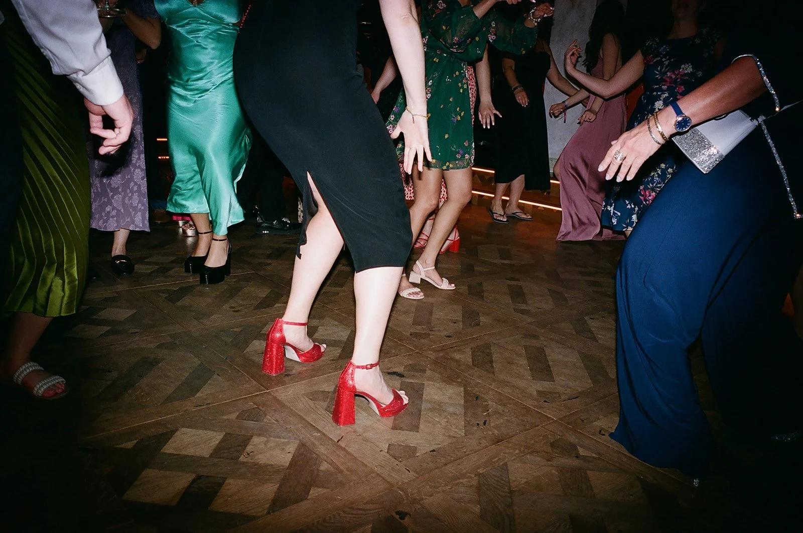 People dancing in formal attire at a party or celebration.