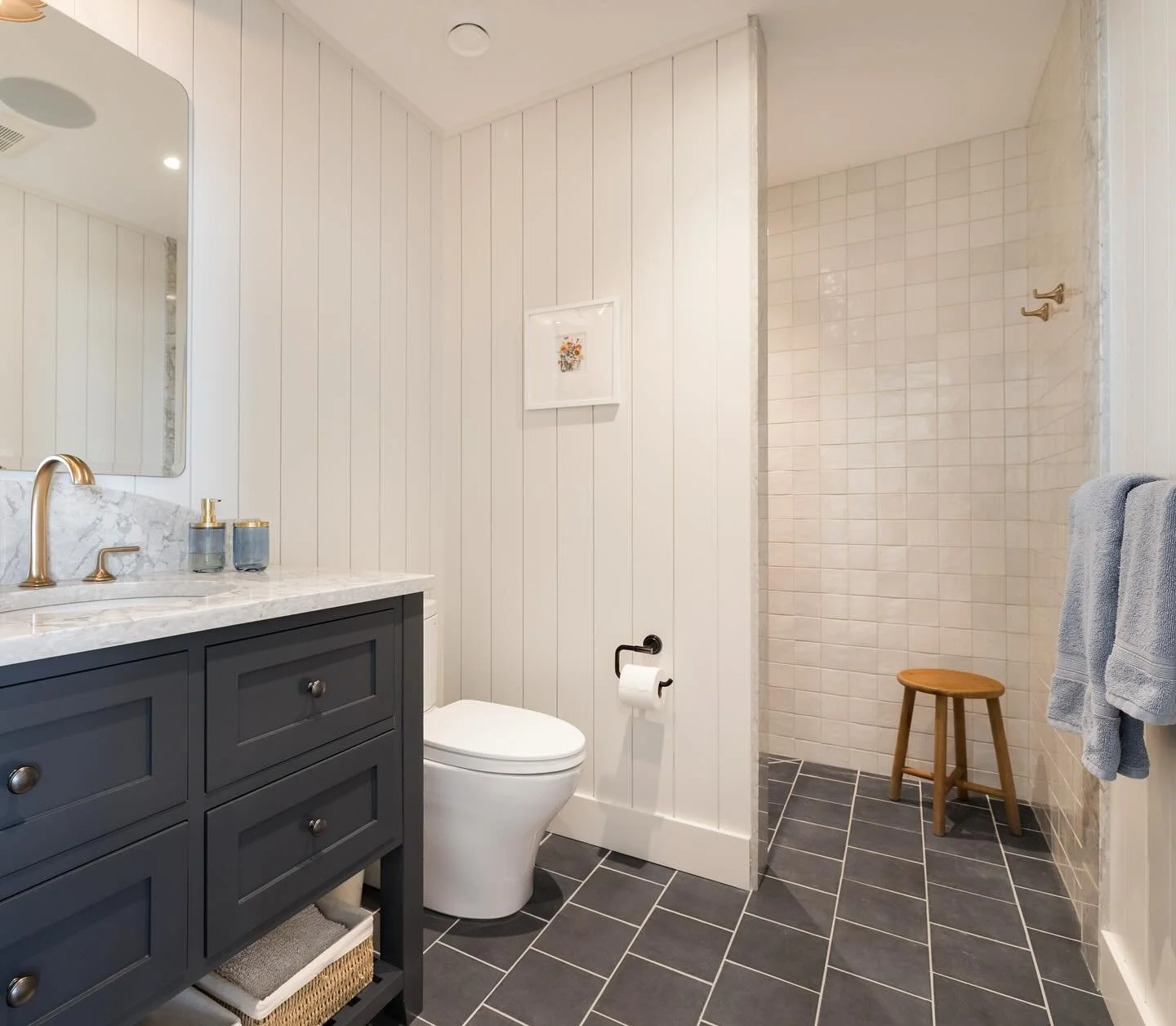 POWDER BATHROOM; typically a small bathroom that contains only a toilet and a sink, without a shower or bathtub.

Not the case in this powder room. Although it serves the purpose of a classic powder being off the living room, we wanted it to be able 