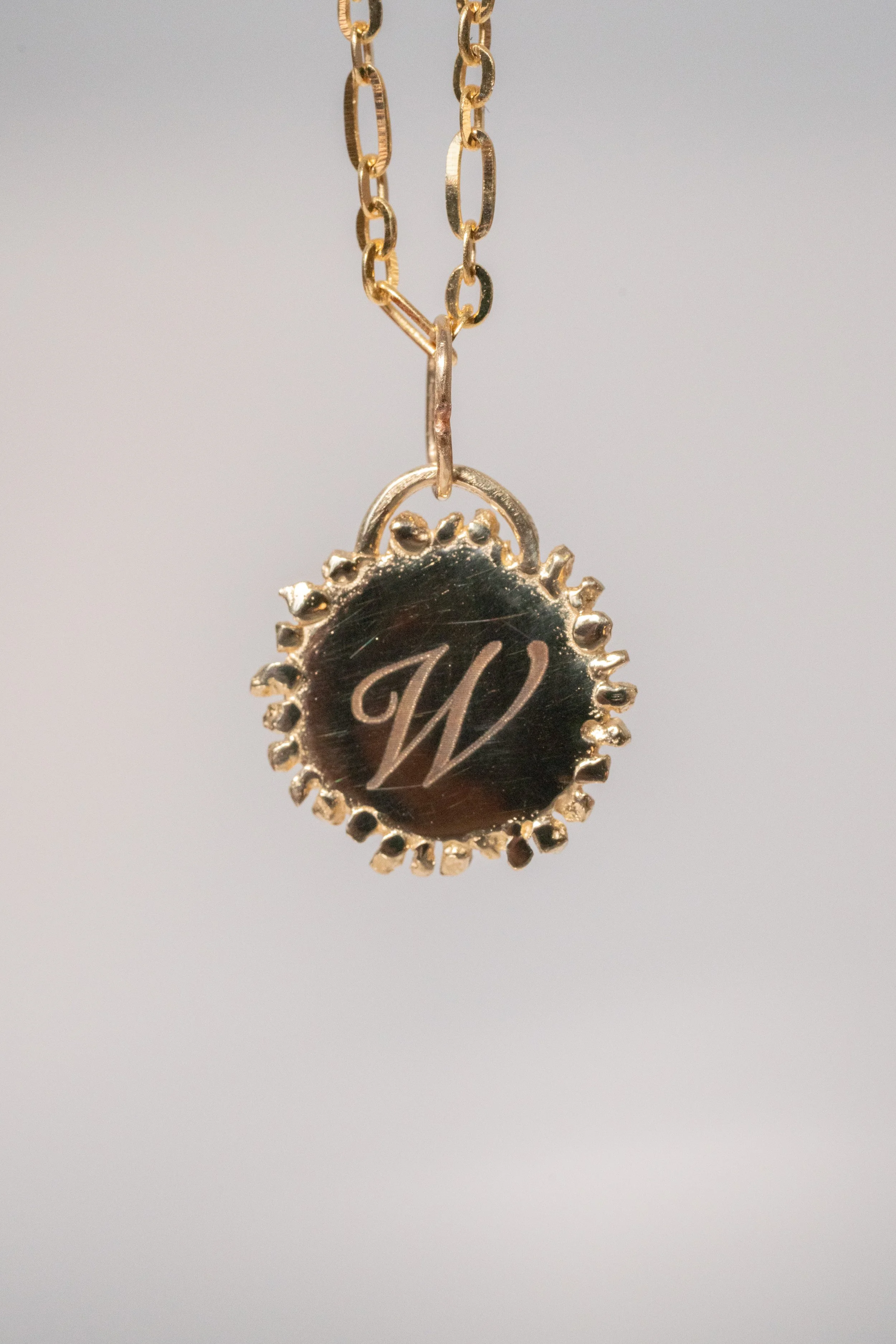 Neptune Medallion Disc Charm