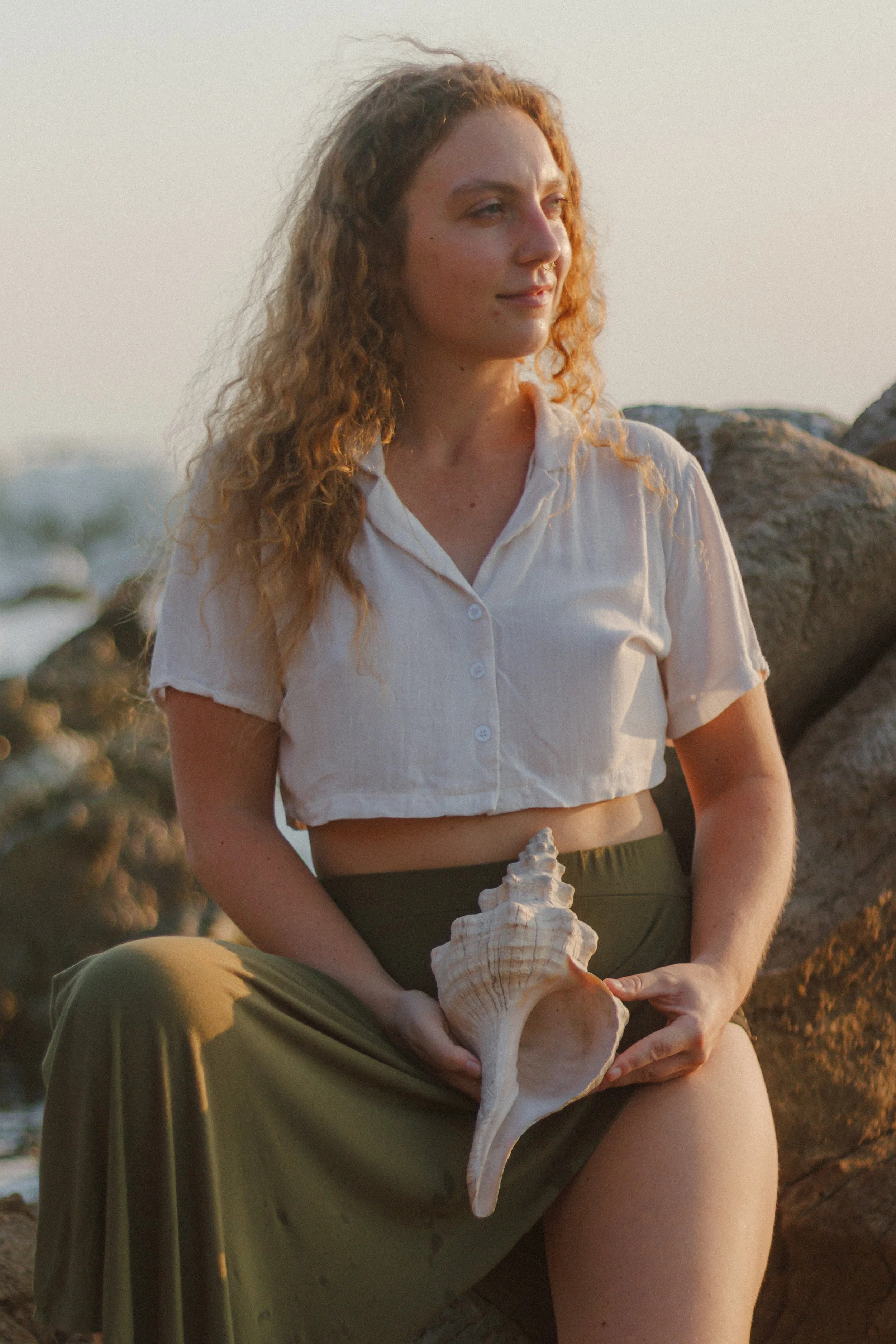 Spiral sea shell placed at the abdomen of naturopathic doctor