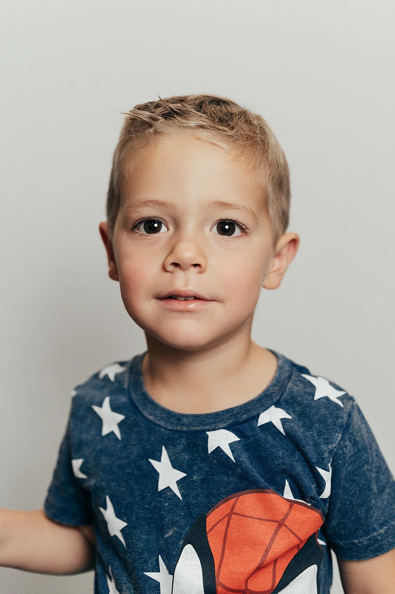 todder boy preschool picture in a Spiderman shirt
