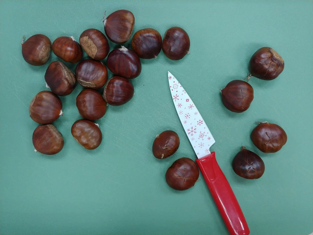Prepping chestnuts to roast.jpeg