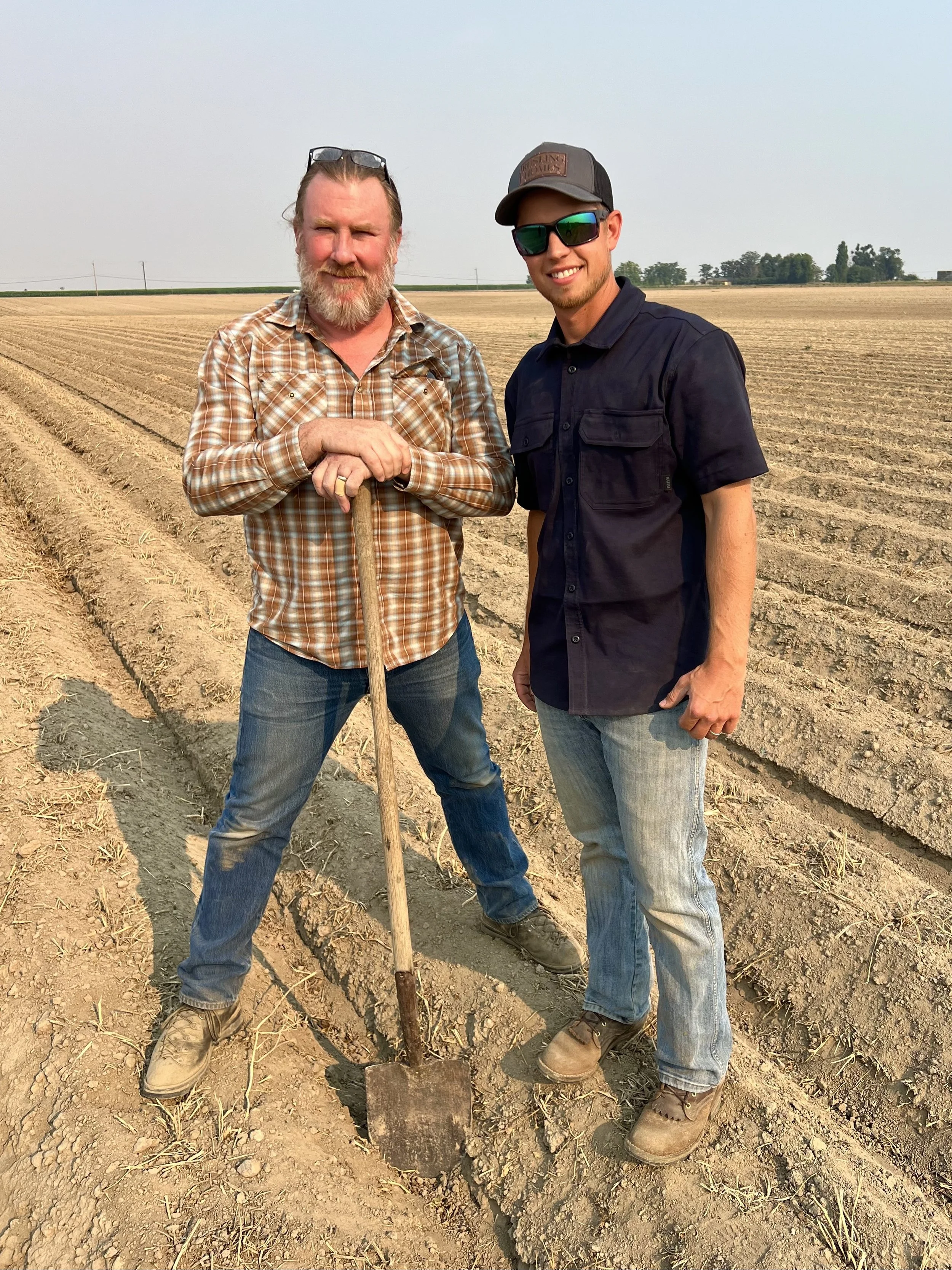 Dan with Ben from Bouchey in fresh crop potato field.jpeg