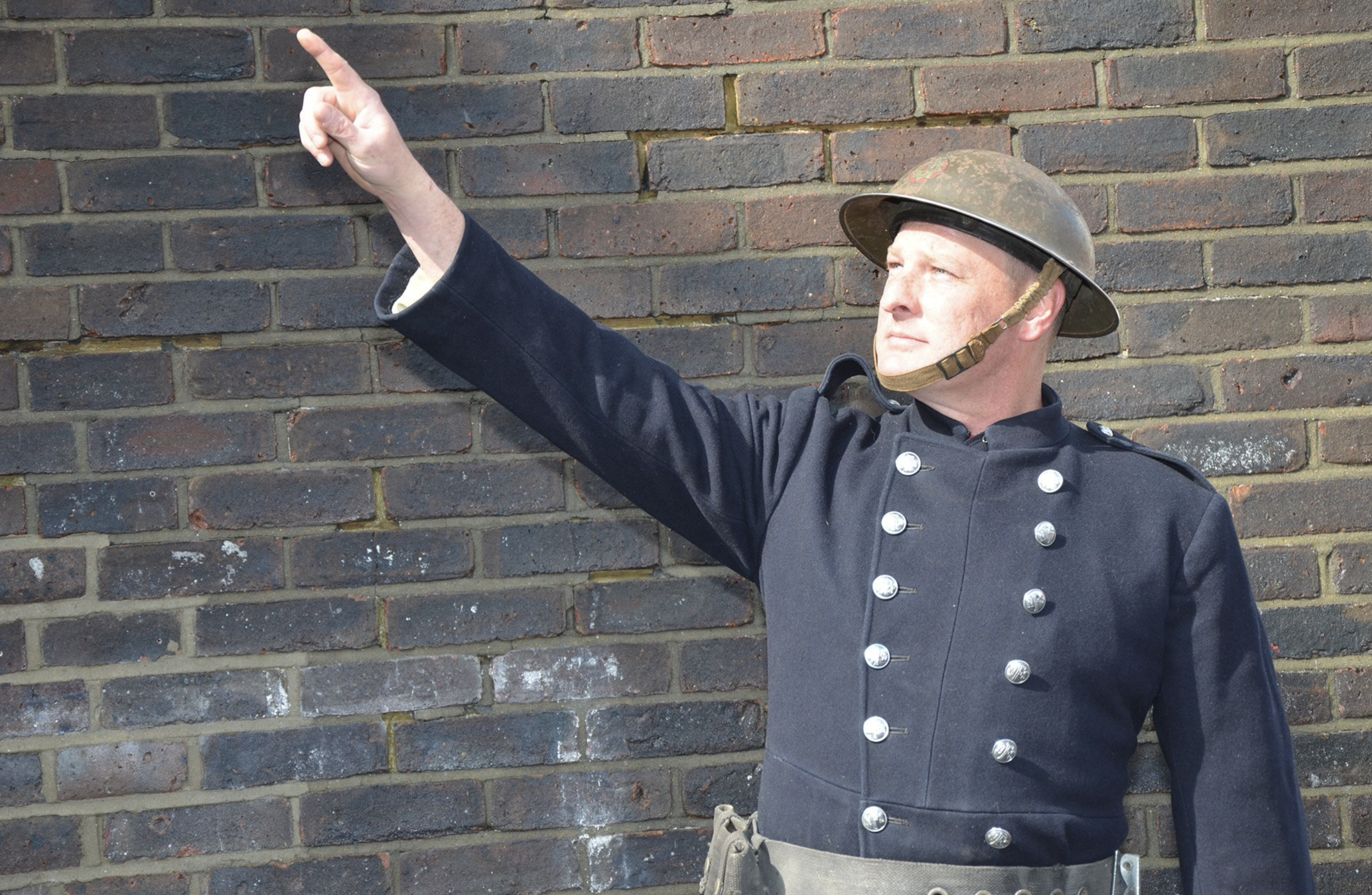 A BRITISH FIREMAN POINTS AT A THING!