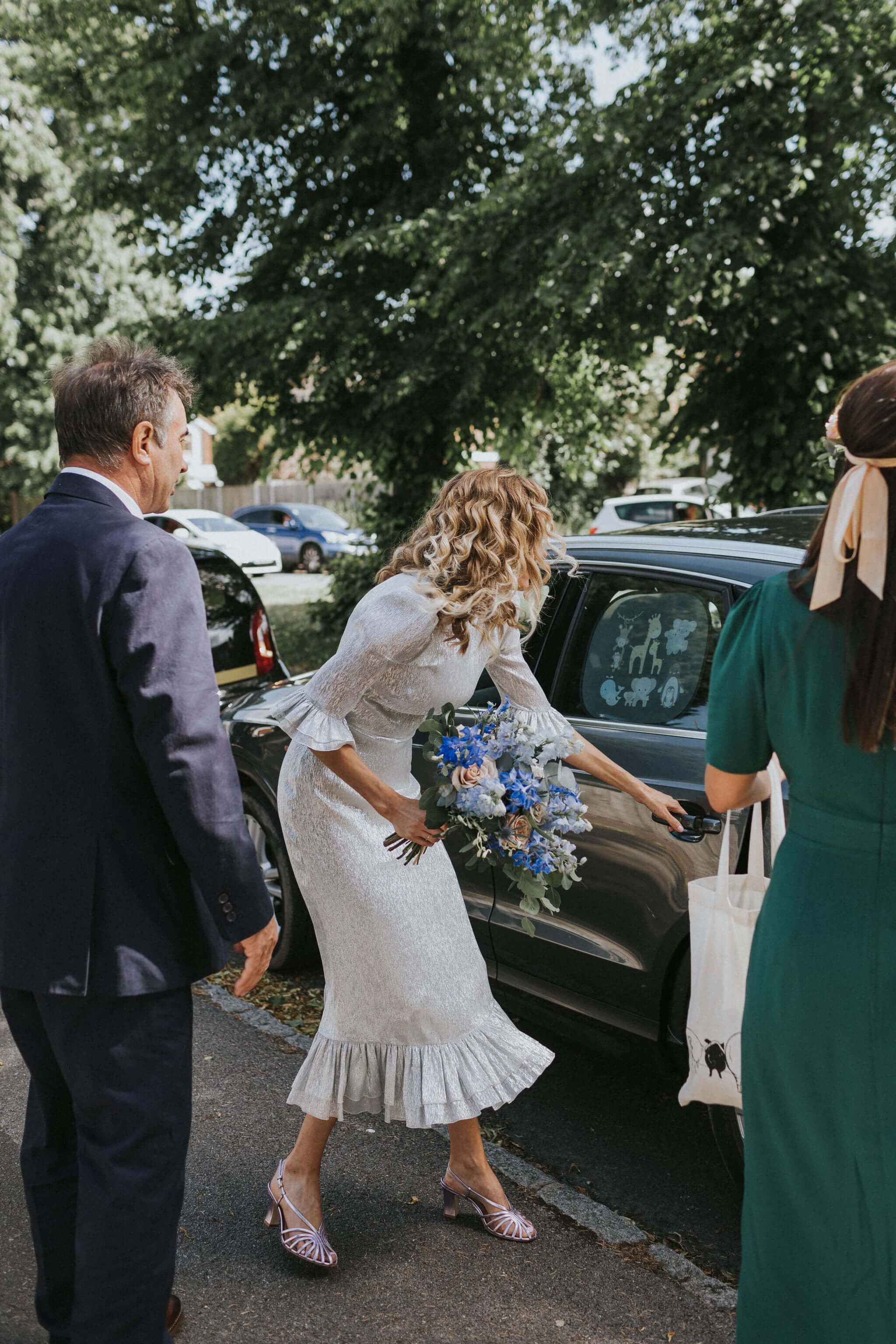 Bride-getting-into-car.jpg