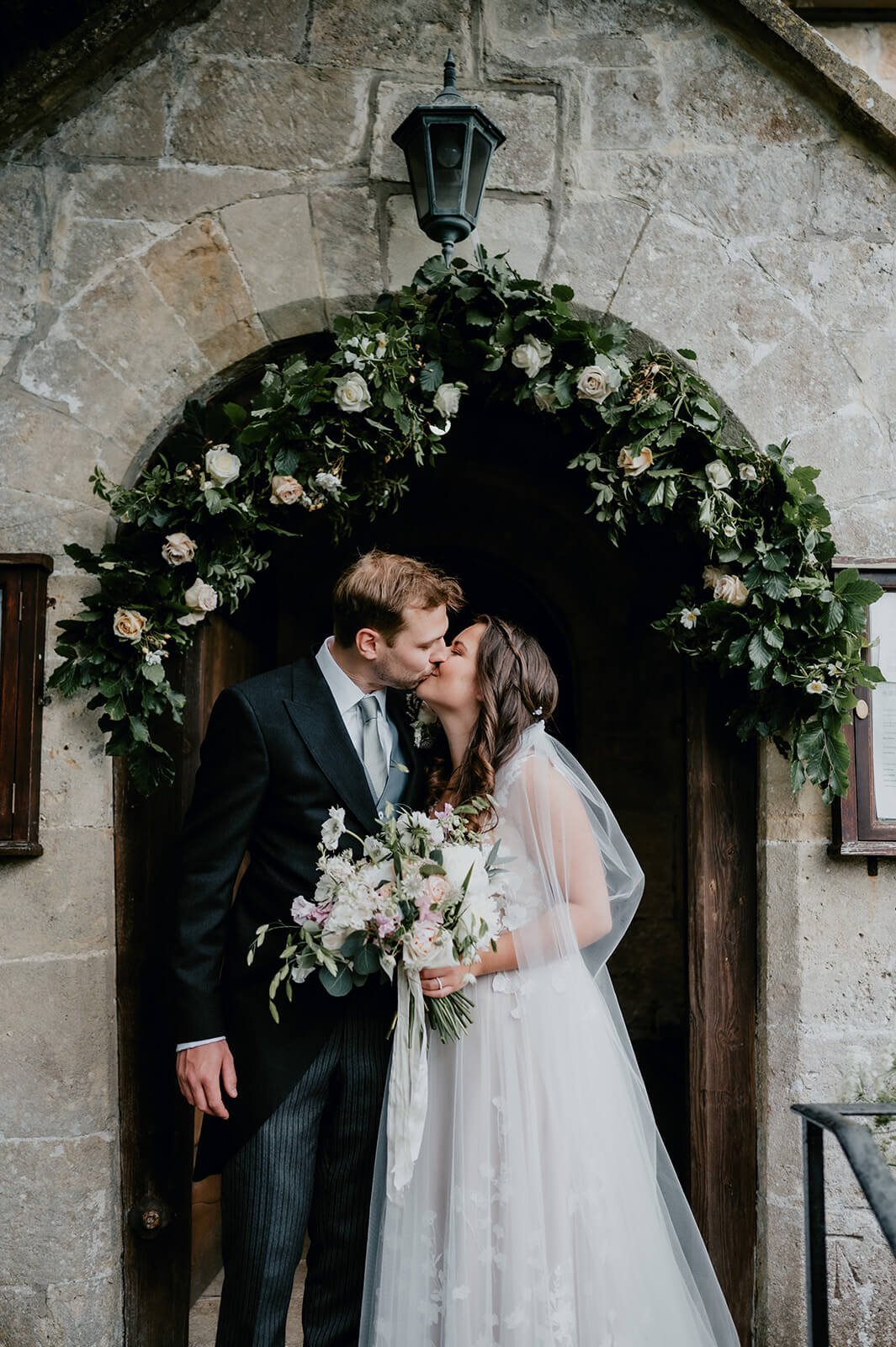 Bride-and-groom-kissing-outside-chruch.jpg