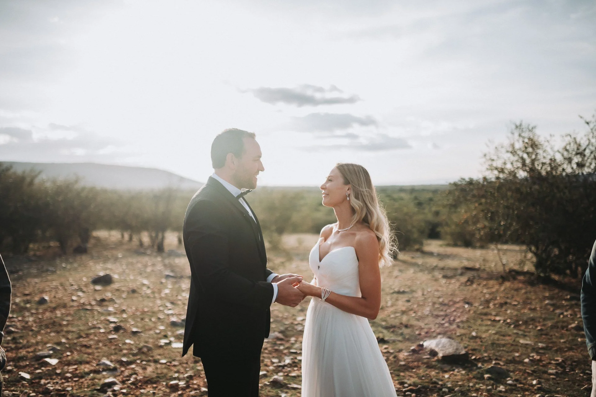 Jon and Amber exchanging vows during their Maasai Mara elopement in Kenya"