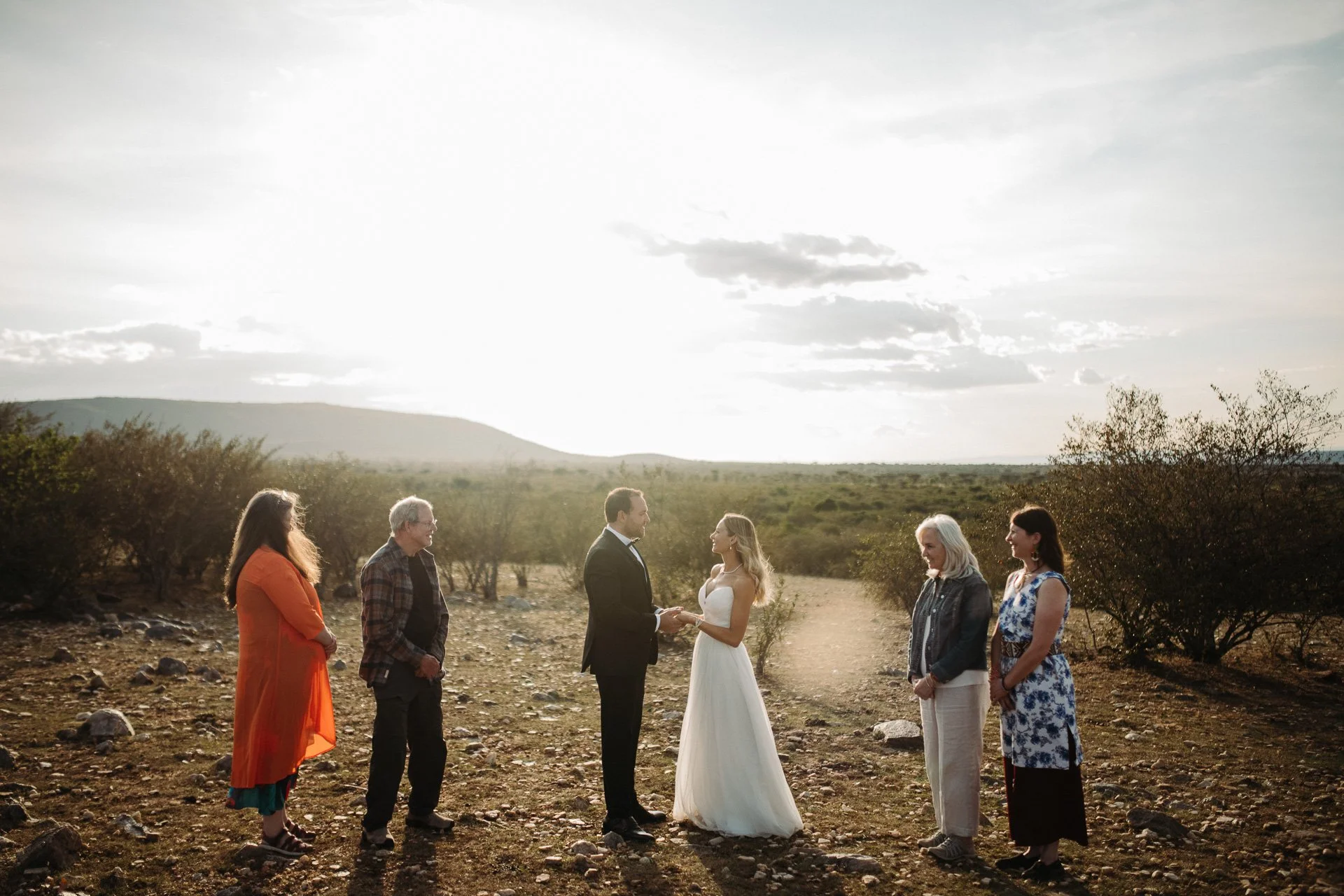Jon and Amber exchanging vows during their Maasai Mara elopement in Kenya"