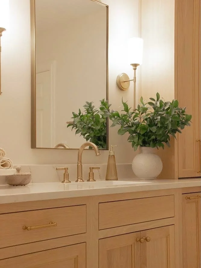 Soft tones, warm wood, and timeless details - because classic will always be in style ✨

.
.
#serene #bathroomgoals #whiteoak #louisvilleinteriordesign #louisvilleky #louisvilleinteriors #classic #bathroomdesign #zellige #showerdesign #louisvilleloca