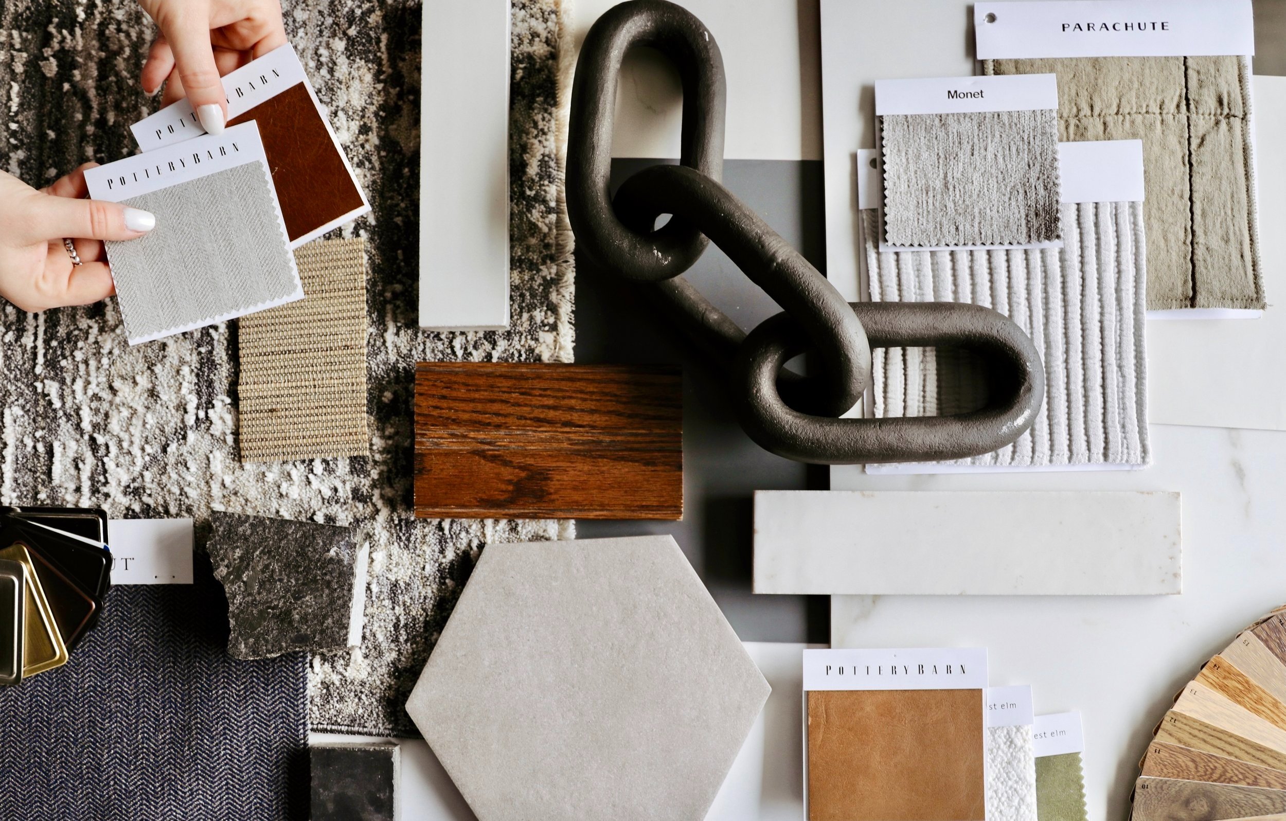 Material design and finishes collage., Interior design materials and finishes collage with fabric swatches, wood samples, tile, and sculptural accents