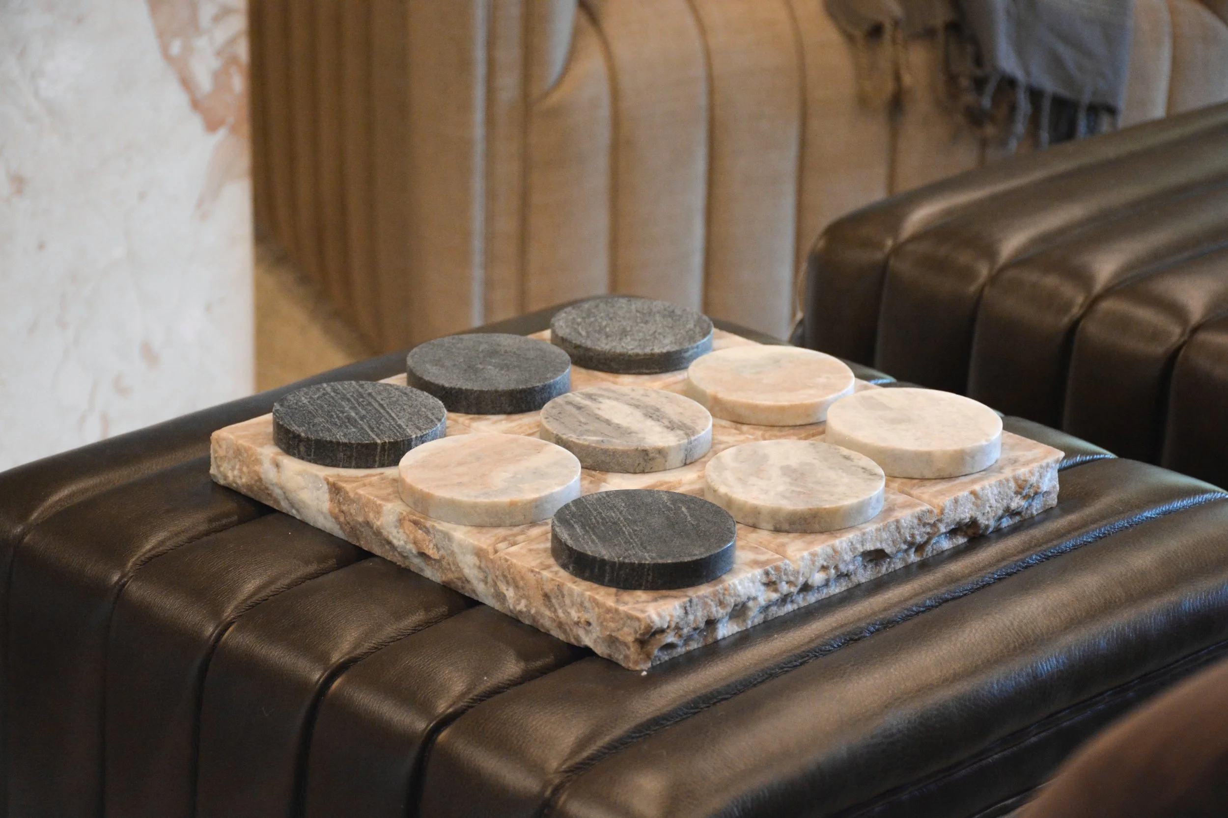 Stone Game Board on Leather Ottoman.jpg
