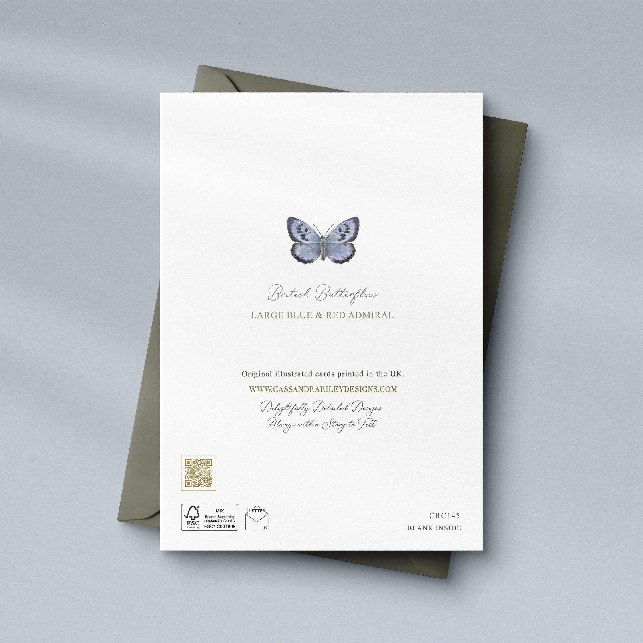Large blue and Red Admiral butterfly greeting card sat on a grey envelope on a blue background.