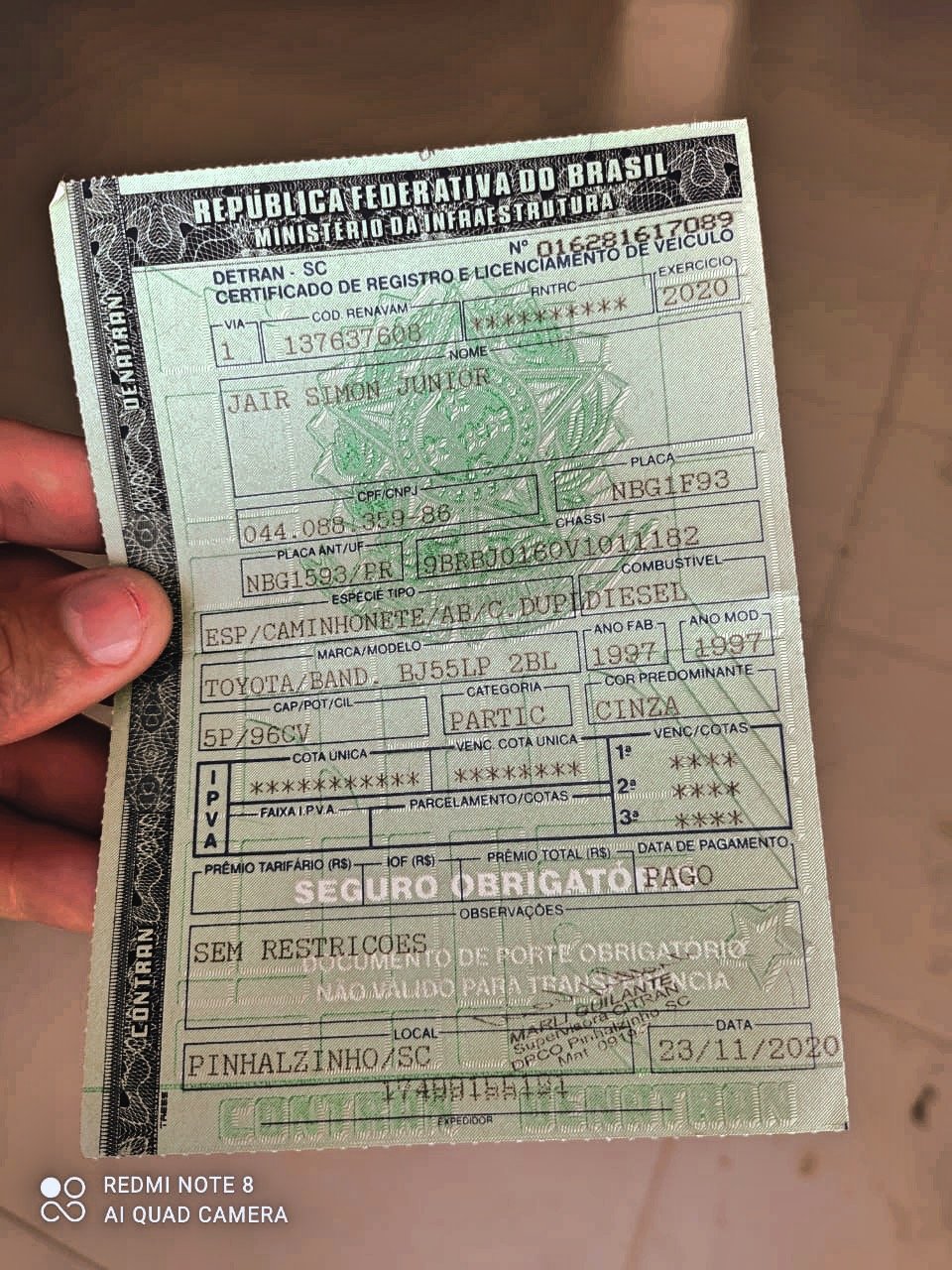 Brazil vehicle registration certificate in hand