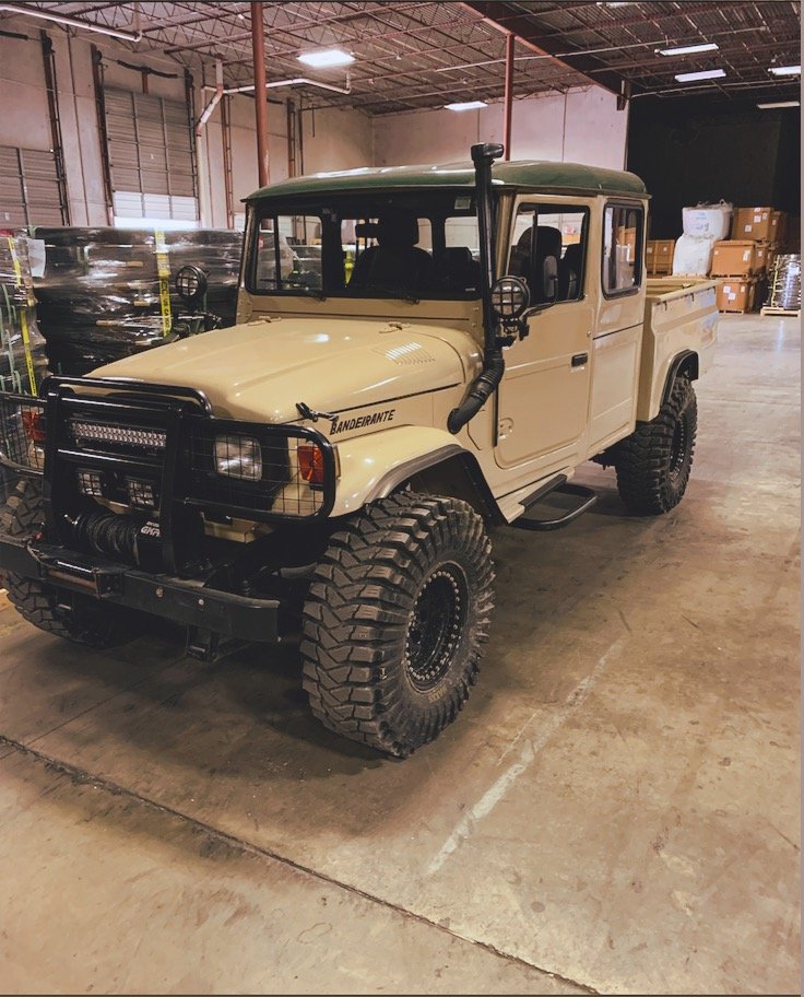Vintage 4x4 truck in a warehouse