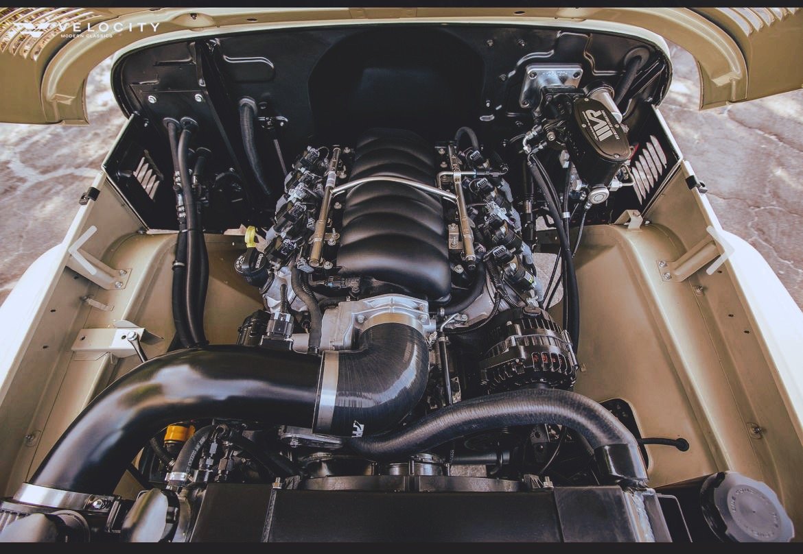 Custom car engine bay with Velocity branding