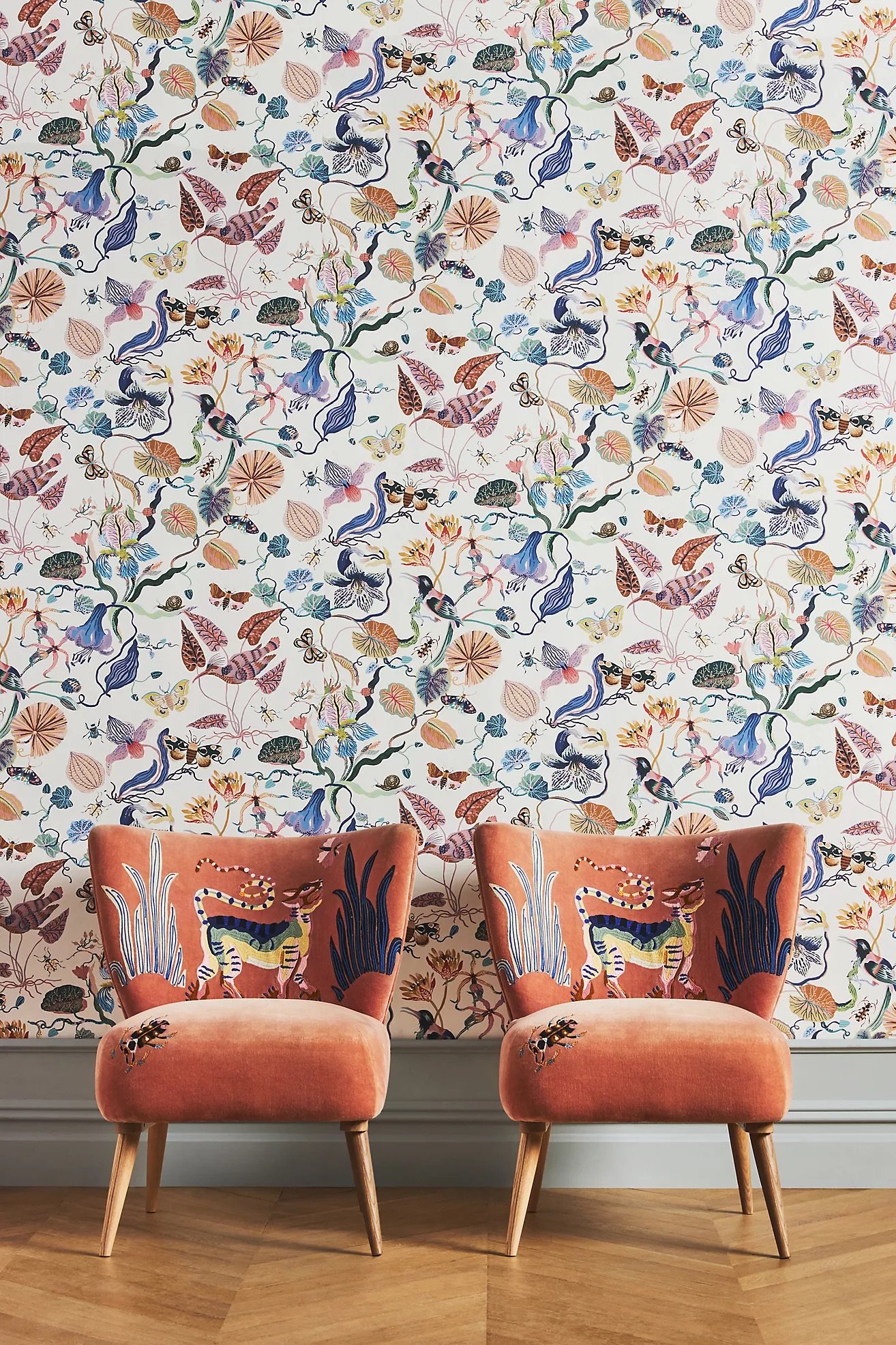 Anthropologie velvet accent chairs and wallpaper by Sarah Gordon