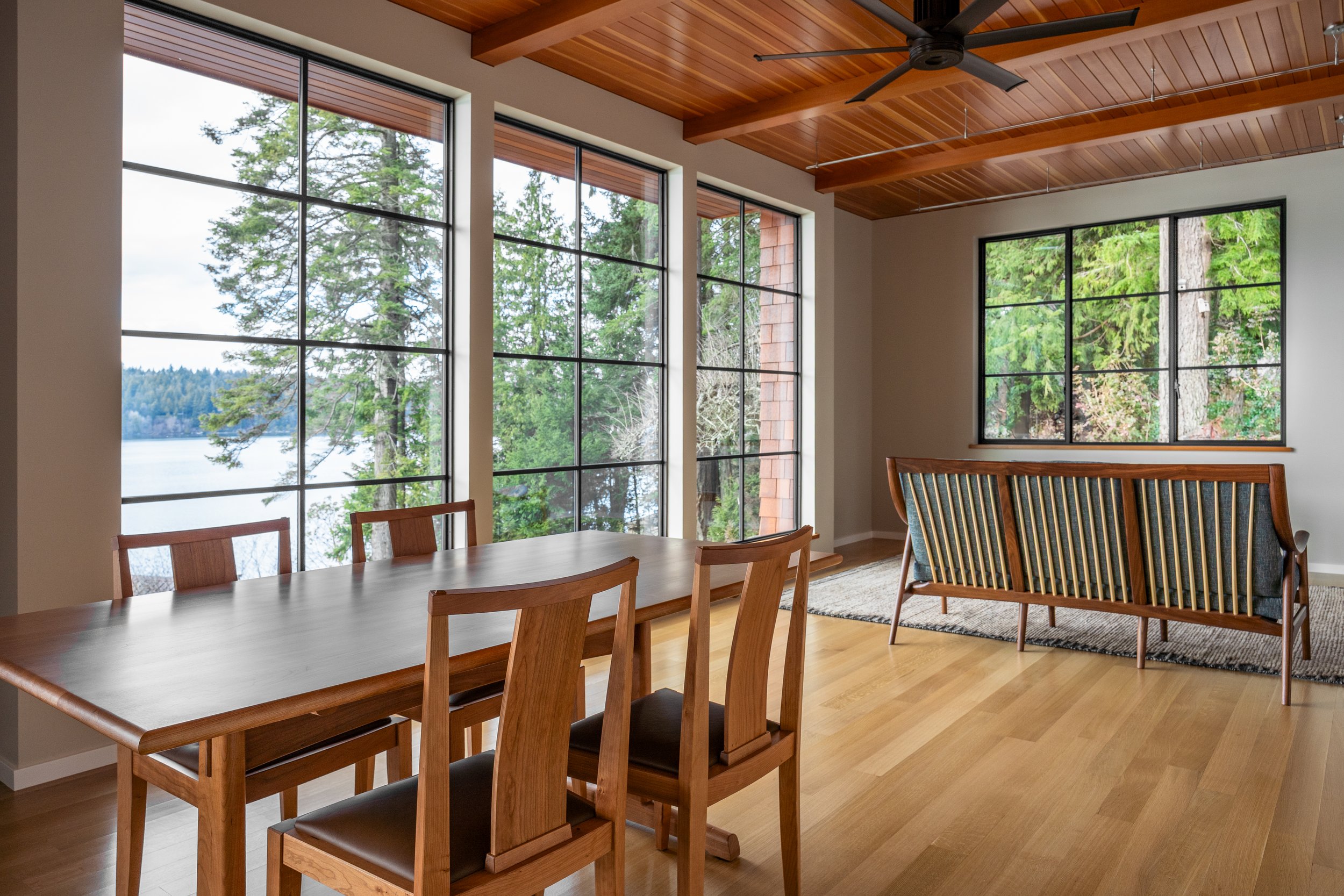 Floor-to-ceiling windows frame an expansive view of the Port Orchard Narrows