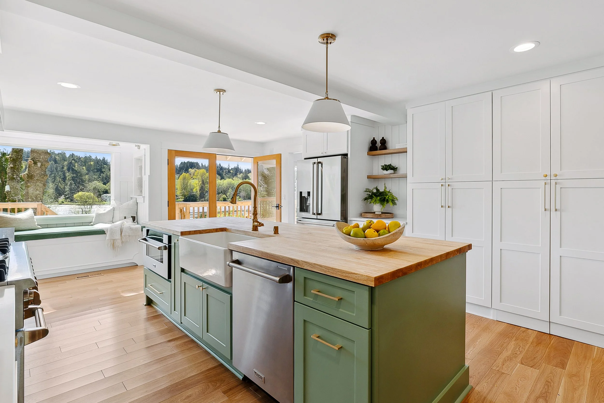Mike Bicer and team created an expansive main floor living space by eliminating obstructive beams and turning a fireplace near the kitchen into a butler’s pantry.