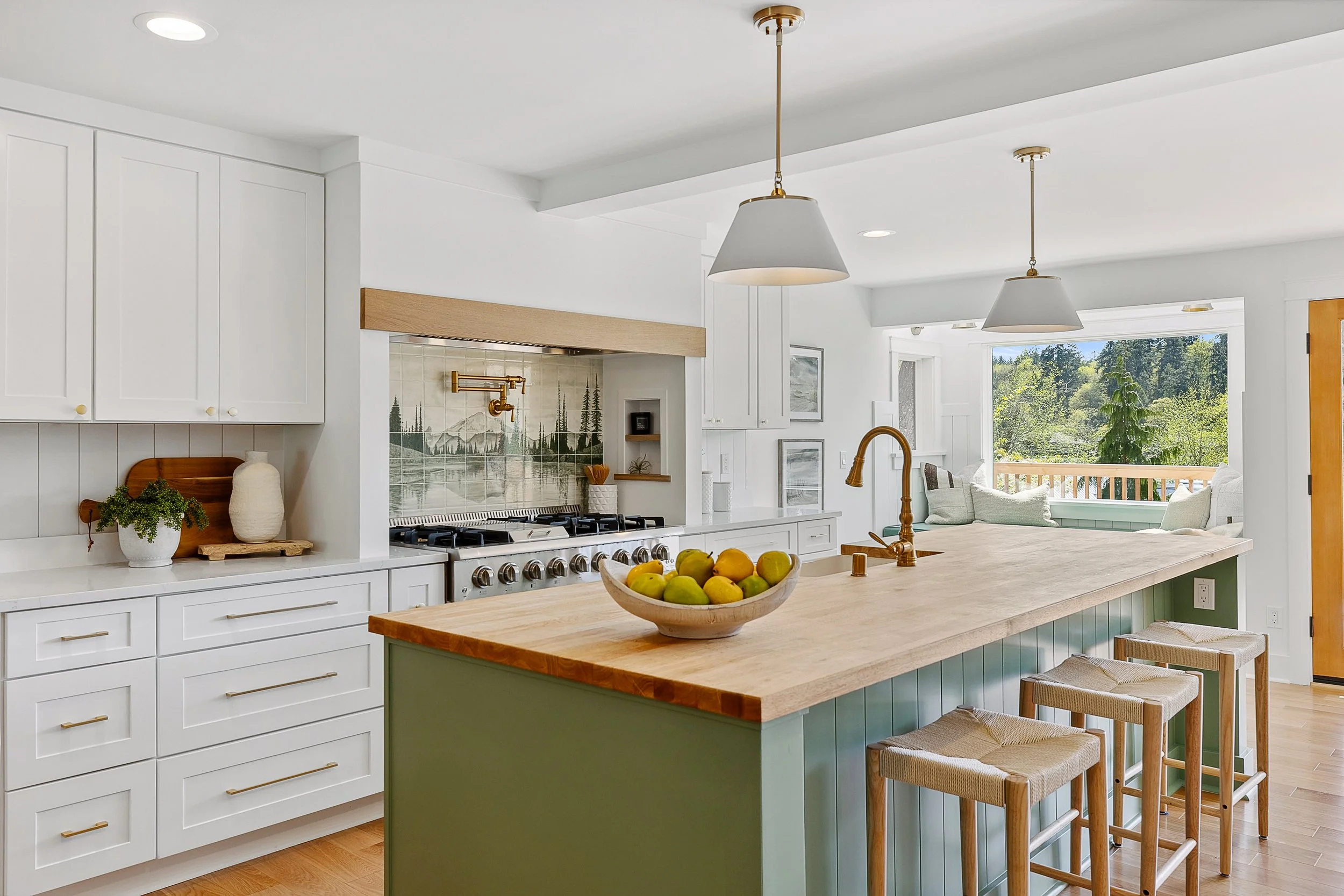 Dariia Bicer, a ceramics artist, created a custom tile backsplash featuring Mt. Rainier, adding a unique bit of artistry.