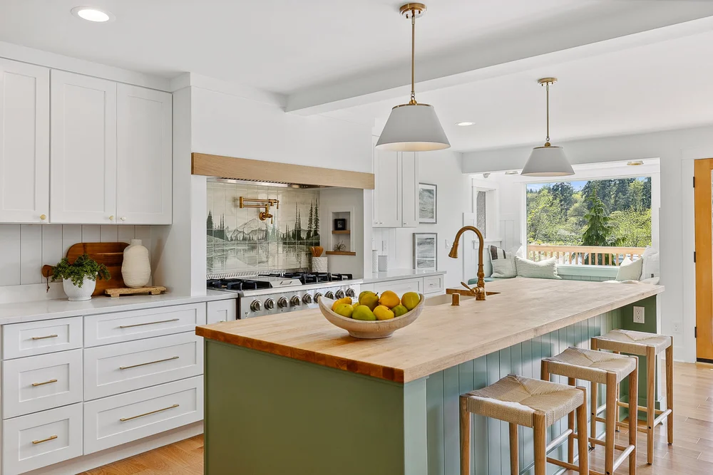 Dariia Bicer, a ceramics artist, created a custom tile backsplash featuring Mt. Rainier, adding a unique bit of artistry.